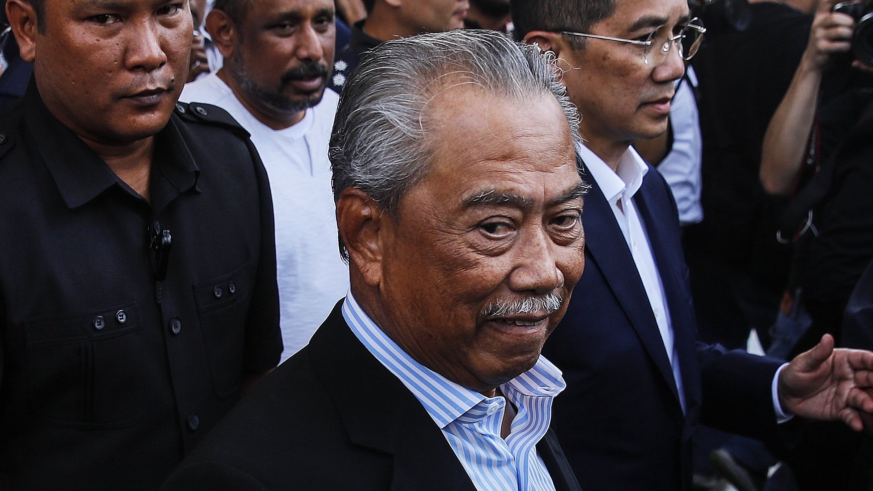 epa10512911 Former Malaysia Prime Minister and Perikatan Nasional (PN) chairman Muhyiddin Yassin leaves Kuala Lumpur High Court, in Kuala Lumpur, Malaysia, 10 March 2023. Muhyiddin has been charged with four counts of abuse of power and two counts of money laundering over economic projects awarded under Jana Wibawa, a COVID-19 stimulus initiative which was introduced when he was Prime Minister. He claimed innocence against all charges in a statement on 10 March.  EPA/FAZRY ISMAIL