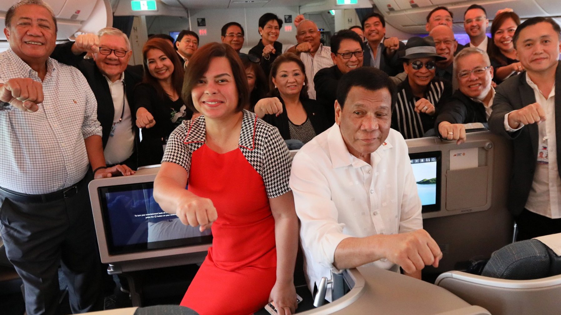 epa06993773 A handout photo made available by the Presidential Photographers Division (PPD) shows President Rodrigo Duterte (R, front) with his daughter, Davao City Mayor Sara Duterte-Carpio (L, front) and members of his delegation posing for a photo on a flight bound for Israel on 02 September 2018 (issued on 03 September 2018). Duterte is on an official one week visit to Israel and Jordan.  EPA/KING RODRIGUEZ / PPD / HANDOUT  HANDOUT EDITORIAL USE ONLY/NO SALES
