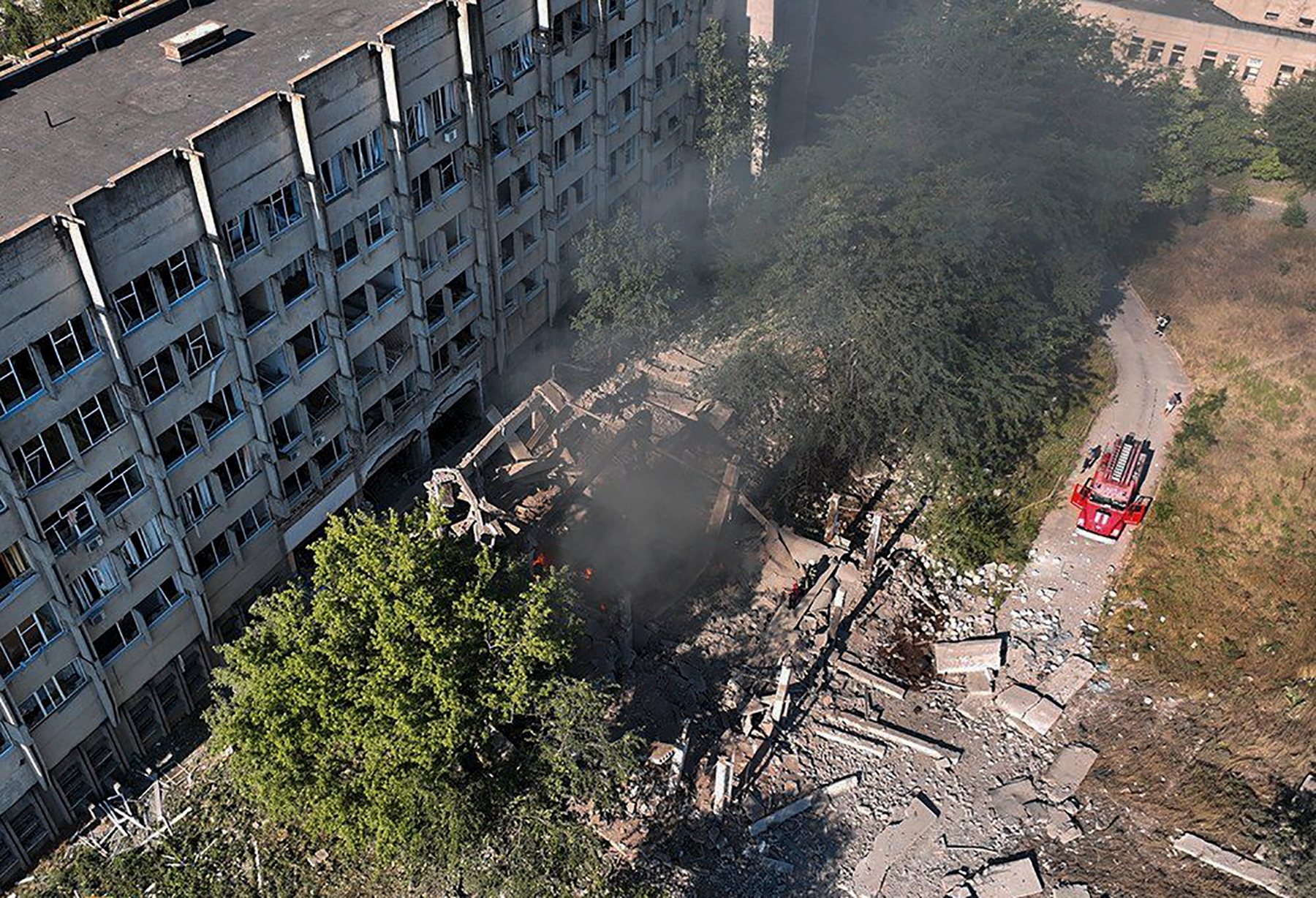 epa10076280 A handout photo made available by the press service of the State Emergency Service of Ukraine shows firefighters and rescuers work at a building damaged in a shelling in Mykolaiv, Ukraine, 17 July 2022.According to Mykolaiv Regional State Administration head Vitaly Kim, Mykolaiv was under massive rocket fire in which two industrial enterprises caught fire.  EPA/UKRAINIAN STATE EMERGENCY SERVICE / HANDOUT  HANDOUT EDITORIAL USE ONLY/NO SALES