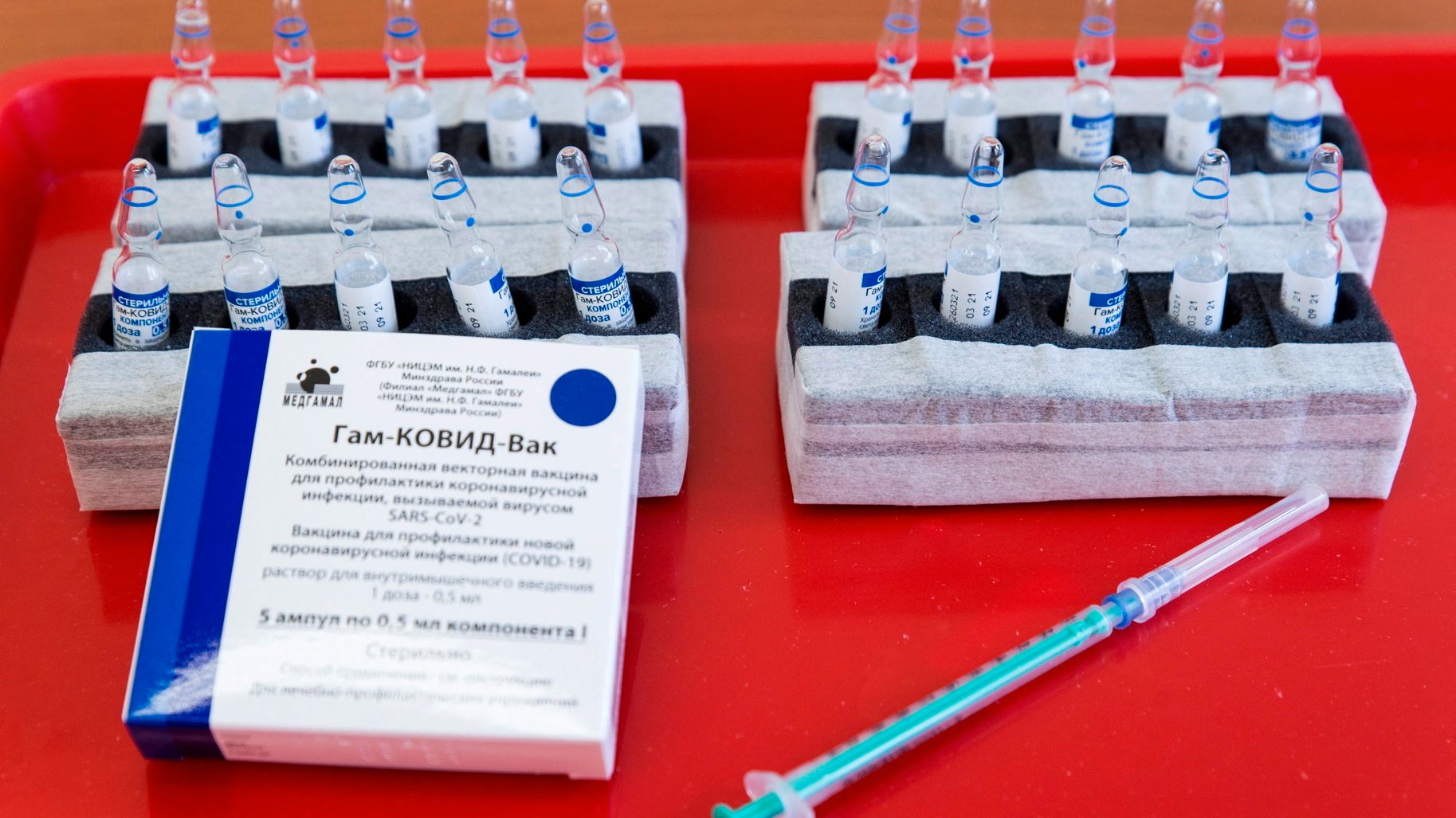 epa09142995 Vials of the Russian Sputnik V vaccine against COVID-19 are prepared to be inoculated to patients in the Petz Aladar Teaching Hospital in Gyor, Hungary, 18 April 2021, as the vaccination drive continues in the country.  EPA/Csaba Krizsan HUNGARY OUT