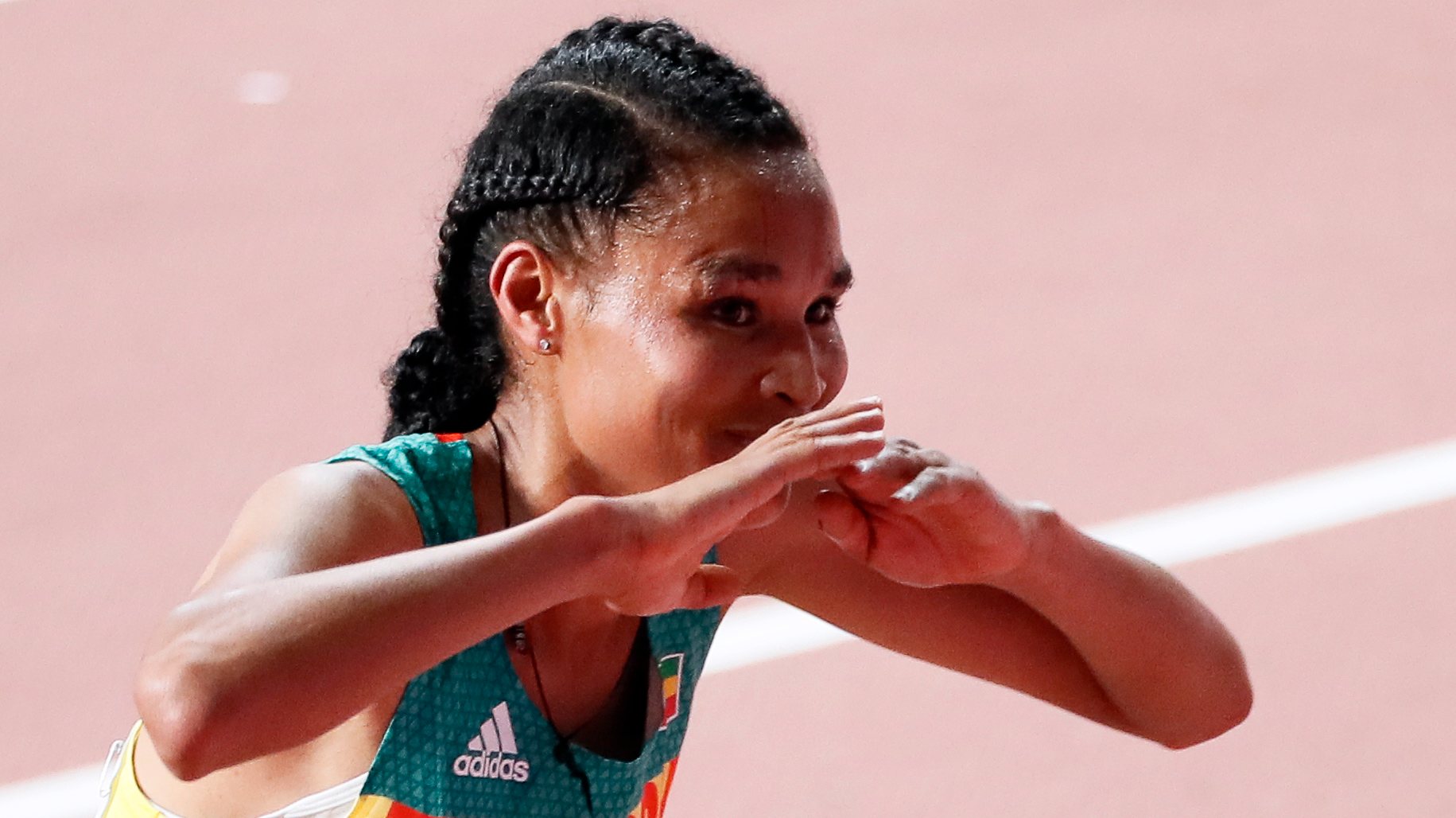 epa07878172 Letesenbet Gidey of Ethiopia celebrates after taking the second place in the women&#039;s 10,000m final during the IAAF World Athletics Championships 2019 at the Khalifa Stadium in Doha, Qatar, 28 September 2019. EPA/ROBERT GHEMENT