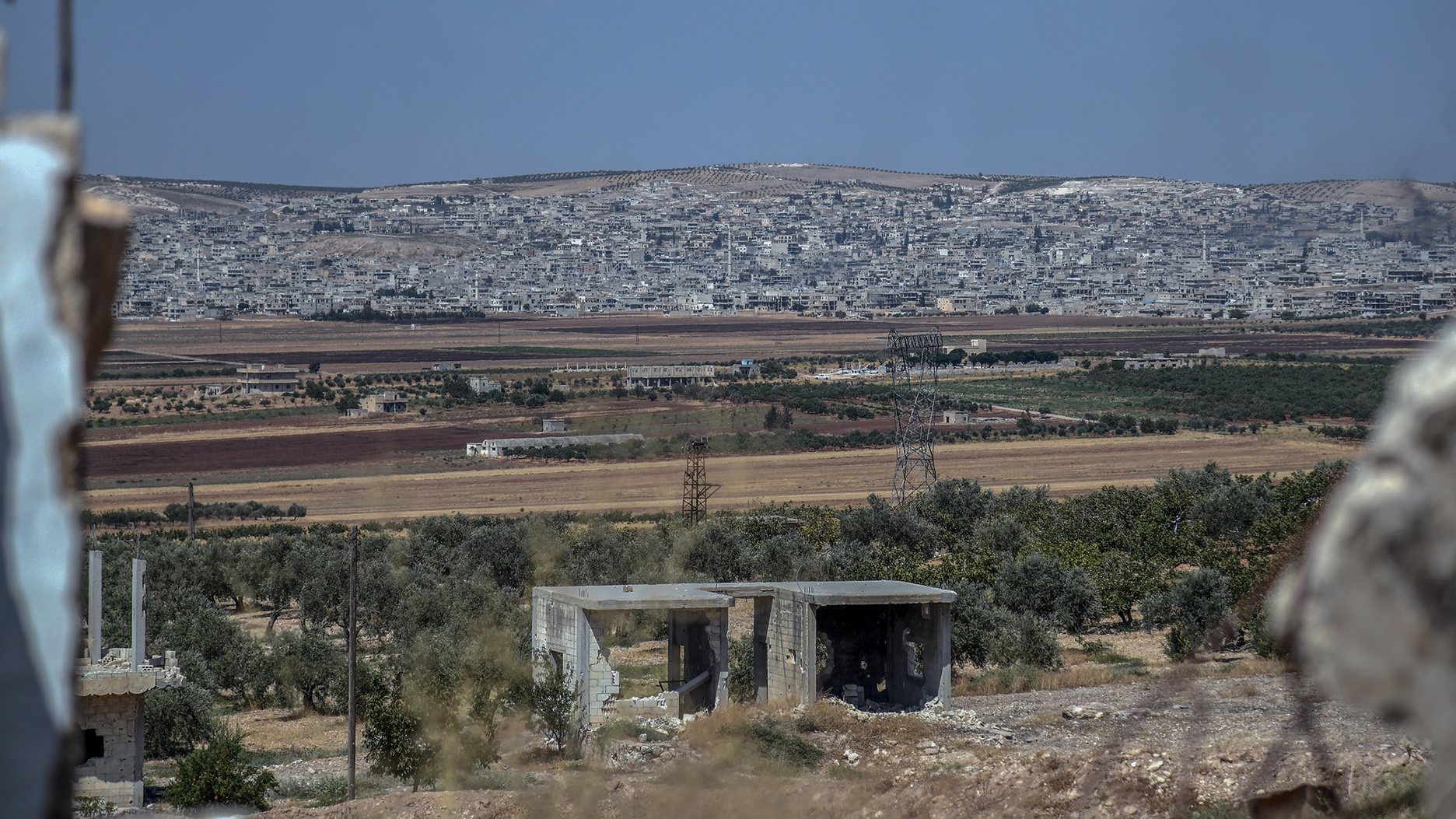 epa07790198 A handout photo made available by the official Syrian Arab News Agency (SANA) shows a general view of damaged buildings in Khan Sheikhoun city area in Idleb southern countryside, Syria, 23 August 2019 (Issued on 24 August 2019). According to SANA, Syrian Arab Army&#039;s units uncovered a network of tunnels dug in mountains which was used as fortified headquarters for Jabhat al-Nusra terrorists and their affiliated groups during combing operations of khan Sheikhoun city and al-Tamani’a area in Idleb southern countryside.  EPA/SANA HANDOUT  HANDOUT EDITORIAL USE ONLY/NO SALES