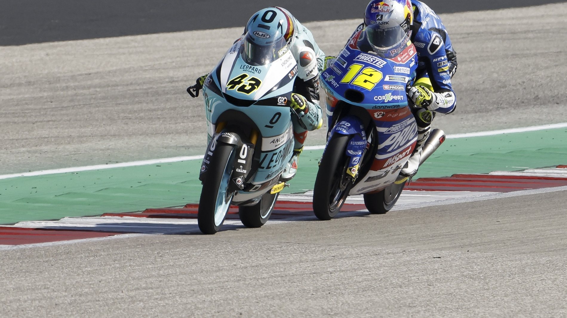 epa09503894 Spanish rider Xavier Artigas (L) of Leopard Racing and Czech rider Filip Salac (R) of Carxpert PruestelGP in action during the Moto3 race of the Motorcycling Grand Prix of the Americas at the Circuit Of The Americas in Austin, Texas, USA, 03 October 2021.  EPA/ERIK LESSER