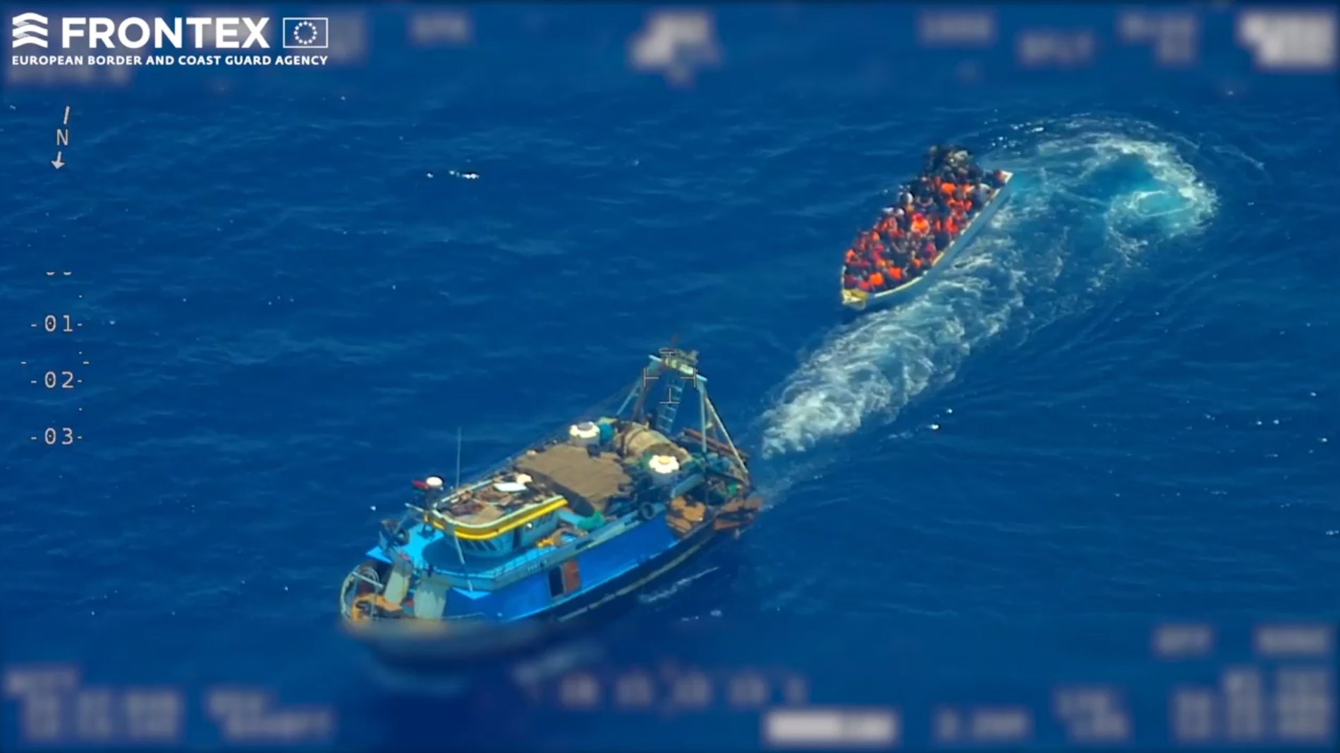 epa07669907 A screen grab taken from an undated handout video made available by the European Border and Coast Guard Agency (Frontex) on 22 June 2019 shows a fishing trawler (L) pulling away from a wooden boat with migrants on board, at high seas in the Mediterranean. According to Frontex, some 80 people emerged from below the deck of the fishing trawler -- a so-called &#039;mother boat&#039; that people smugglers use to carry large groups of migrants across the sea -- and got into the smaller boat. After the migrant boat was filled with people it slowly headed toward the Italian island of Lampedusa as the fishing trawler quickly moved away. Frontex said that it used a plane and a drone to observe the fishing trawler and the boat with migrants for several hours; it also alerted Italian and Maltese authorities and the EUNAVFOR Med (Operation Sophia). Italian authorities, who are investigating the case, started a complex operation that caught up with the bigger vessel and arrested the suspected people smugglers and the migrant boat was intercepted in the Italian waters.  EPA/FRONTEX, THE EUROPEAN BORDER AND COAST GUARD AGENCY HANDOUT  HANDOUT EDITORIAL USE ONLY/NO SALES