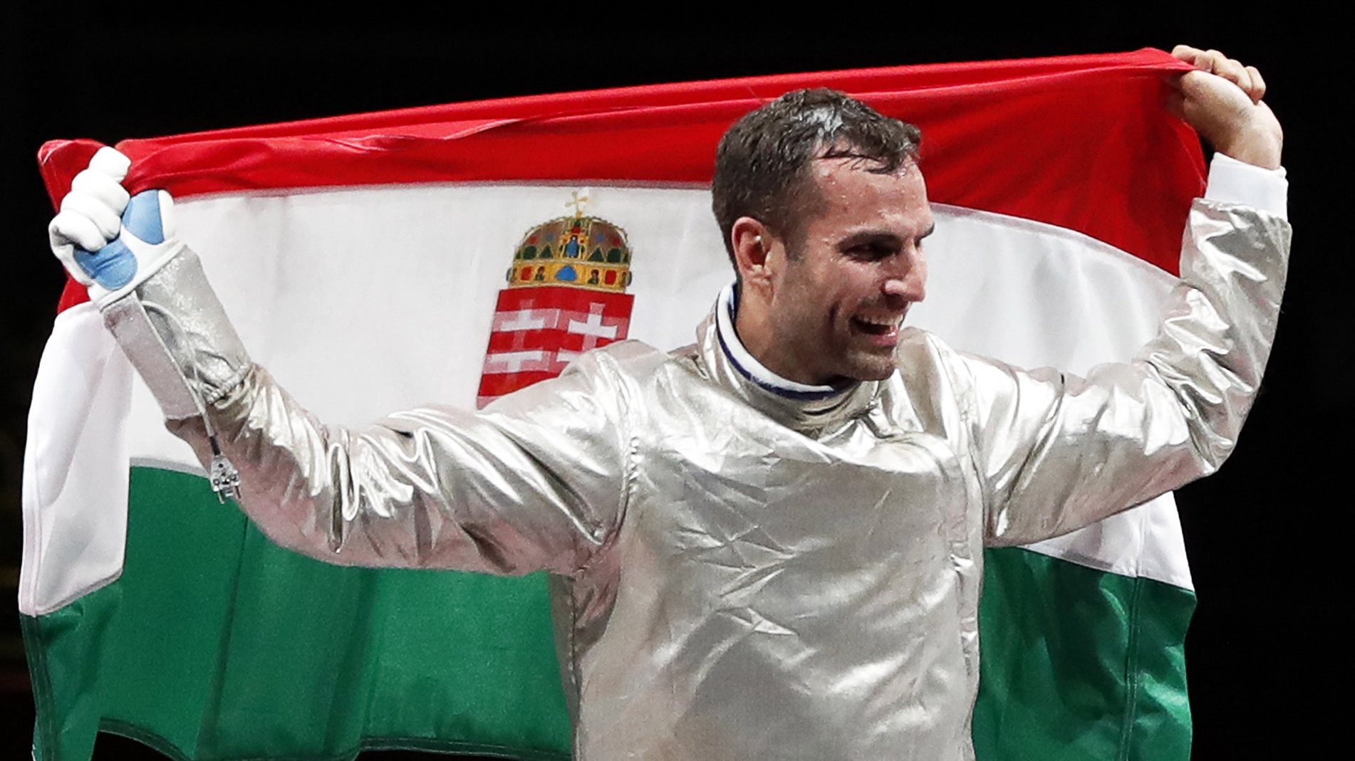epa09362140 Aron Szilagyi of Hungary celebrates winning the gold medal during the men&#039;s Sabre individual Gold Medal Bout during the Fencing events of the Tokyo 2020 Olympic Games at the Makuhari Messe convention centre in Chiba, Japan, 24 July 2021.  EPA/KIYOSHI OTA