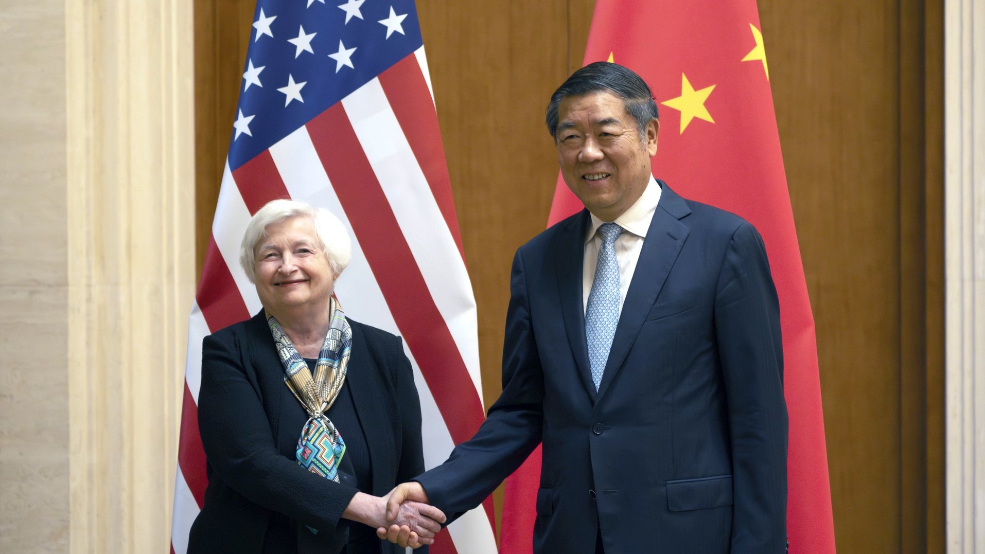 epa10733636 US Treasury Secretary Janet Yellen (L) shakes hands with Chinese Vice Premier He Lifeng during a meeting at the Diaoyutai State Guesthouse in Beijing, China, 08 July 2023.  EPA/MARK SCHIEFELBEIN / POOL