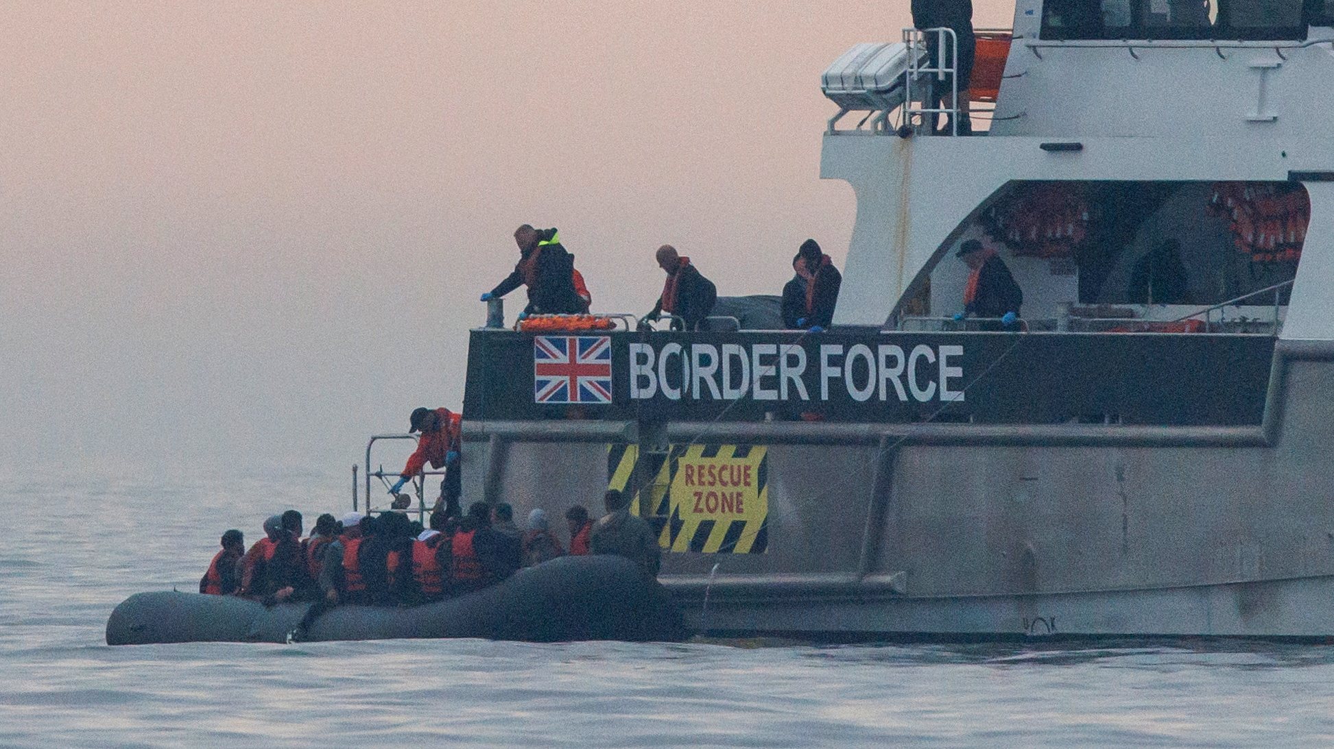epaselect epa10817342 A UK Border Force ship rescues migrants crossing the English Channel on a small boat on 24 August 2023. So far in 2023, more than 17,000 migrants have crossed the English Channel, one of the busiest shipping lanes in the world. Despite the UK and French governments&#039; efforts and warnings to prevent migrants making the dangerous journey on small boats, many are willing to take the risk to claim asylum in the UK.  EPA/TOLGA AKMEN BEST QUALITY AVAILABLE