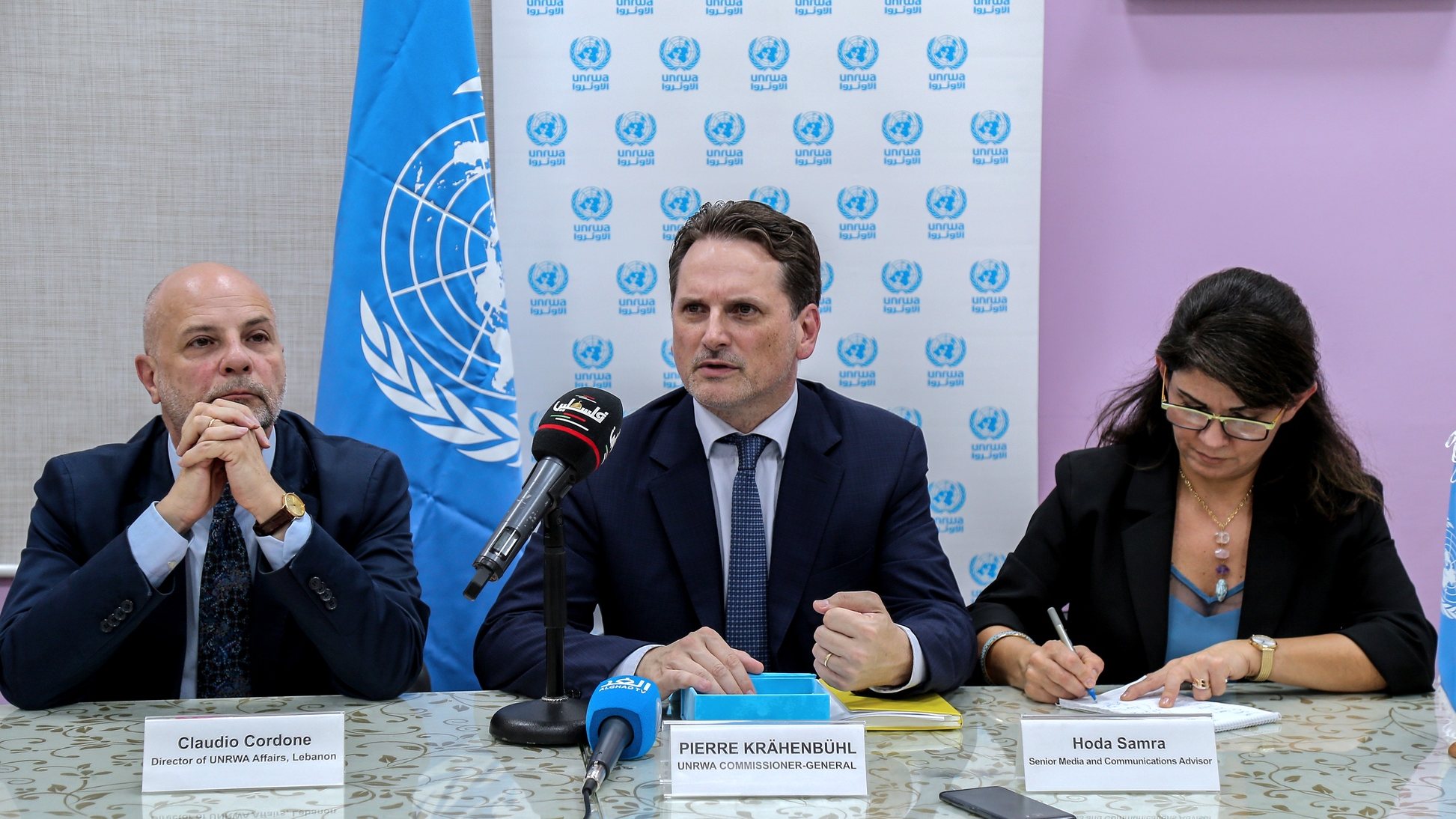 epa07837492 Commissioner-General of the United Nations Relief and Works Agency for Palestine Refugees in the Near East (UNRWA) Pierre Krahenbuhl (C) and director of UNRWA in Lebanon Claudio Cordone (L) during a press conference, at Al-Yarmouk school run by UNRWA in Bourj Barajneh Palestinian refugees camp in southern suburb of Beirut, Lebanon 12 September 2019. According to reports, Krahenbuhl attended a ceremony to mark the start of the new school season 2019-2020 in Lebanon. The US decided to cut 300 million US dollars of its funding to UNRWA last year, followed by a further 60 million US dollars in January this year, which is expected to affect services provided to nearly five million Palestinian refugees located in Syria, Jordan, Lebanon, the Gaza Strip, West Bank, and East Jerusalem.  EPA/NABIL MOUNZER