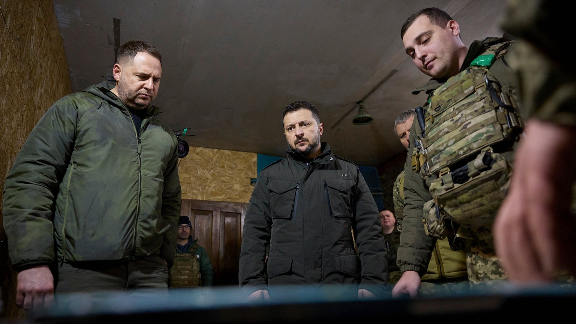epa11166136 A handout picture made available by the Presidential Press Service shows President of Ukraine Volodymyr Zelensky (C) with servicemen during his visit to the battalion command post of the 14th separate mechanized brigade named after Prince Roman the Great, near a frontline in the Kupyansk area, Ukraine, 19 February 2024 amid the Russian invasion. Russian troops entered Ukrainian territory on 24 February 2022, starting a conflict that has provoked destruction and a humanitarian crisis.  EPA/PRESIDENTIAL PRESS SERVICE HANDOUT HANDOUT 44296 HANDOUT EDITORIAL USE ONLY/NO SALES HANDOUT EDITORIAL USE ONLY/NO SALES