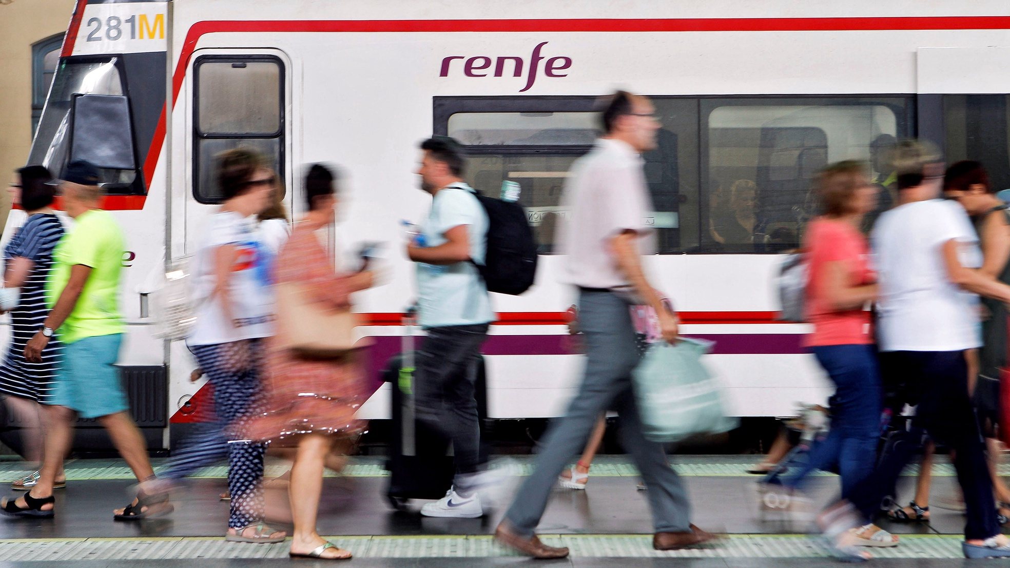epa07750151 Several people walk pass a train way in Valencia, eastern Spain, 31 July 2019 on the first of a four-day of strike by workers of the Spanish rail network RENFE called by union CGT. CGT, to demand new contracts to replace vacancies. Some 1,152 services across the country have been cancelled.  EPA/ANA ESCOBAR