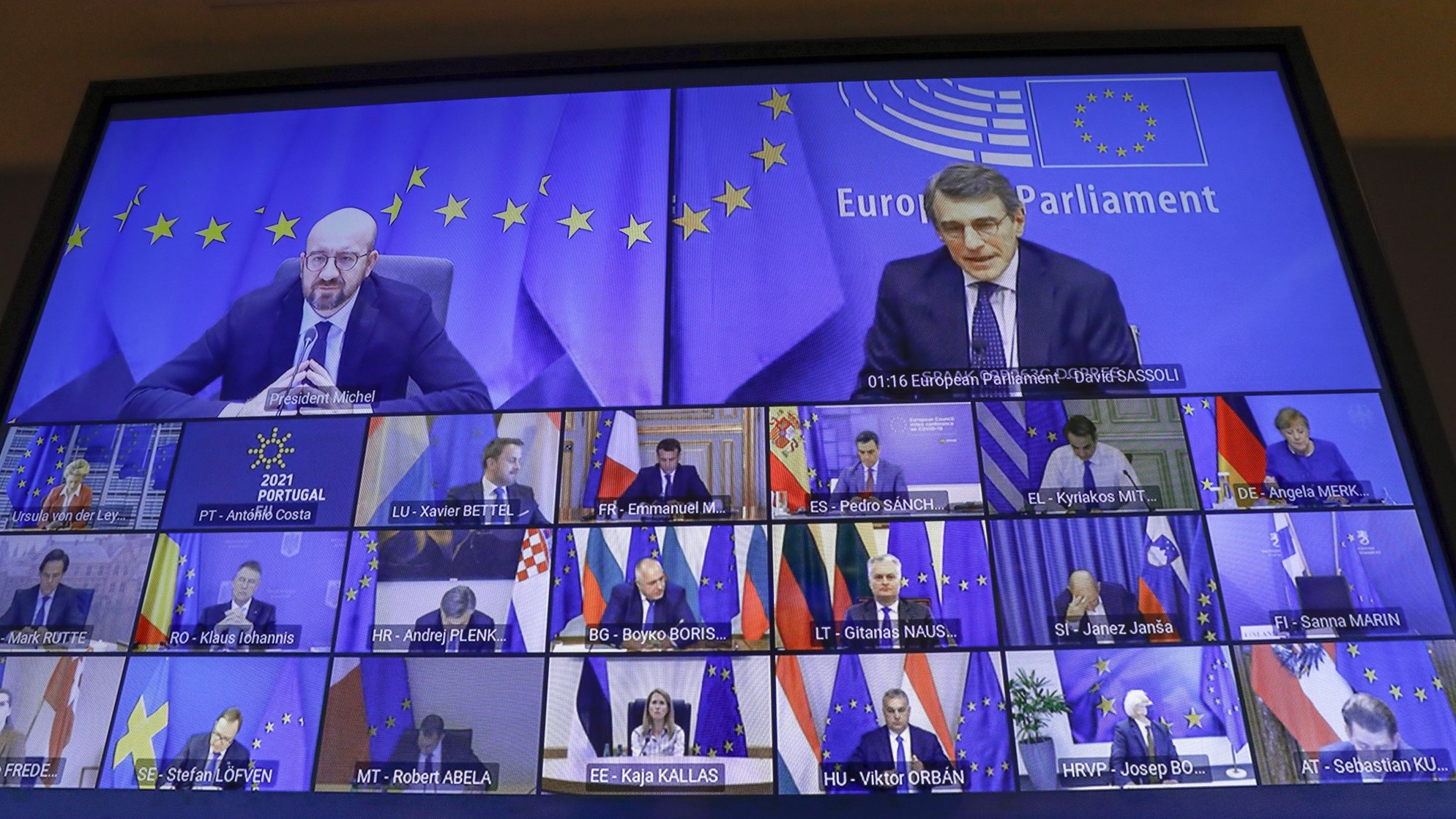 epa09035706 European Council President Charles Michel and European Parliament President David Sassoli with other EU leaders on screen at the start of a EU Council two-days video conference on the COVID-19 pandemic, in Brussels, Belgium, 25 February 2021. EU leaders will take stock of the epidemiological situation. They will continue working to coordinate the response to the COVID-19 pandemic, focusing in particular on the authorisation, production and distribution of vaccines and the movement of persons.  EPA/OLIVIER HOSLET / POOL