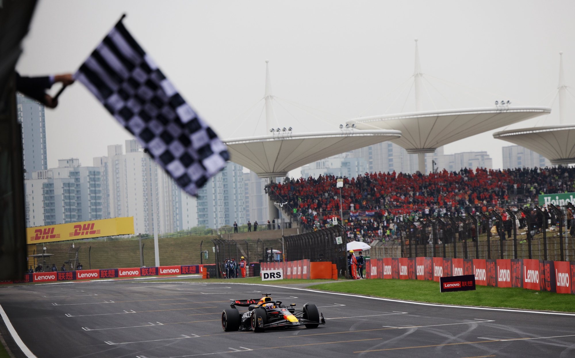 epa11291174 Red Bull Racing driver Max Verstappen of the Netherlands passes the chequered flag as he wins the Formula One Chinese Grand Prix, in Shanghai, China, 21 April 2024. The 2024 Formula 1 Chinese Grand Prix is held at the Shanghai International Circuit racetrack on 21 April after a five-year hiatus.  EPA/ANDRES MARTINEZ CASARES / POOL