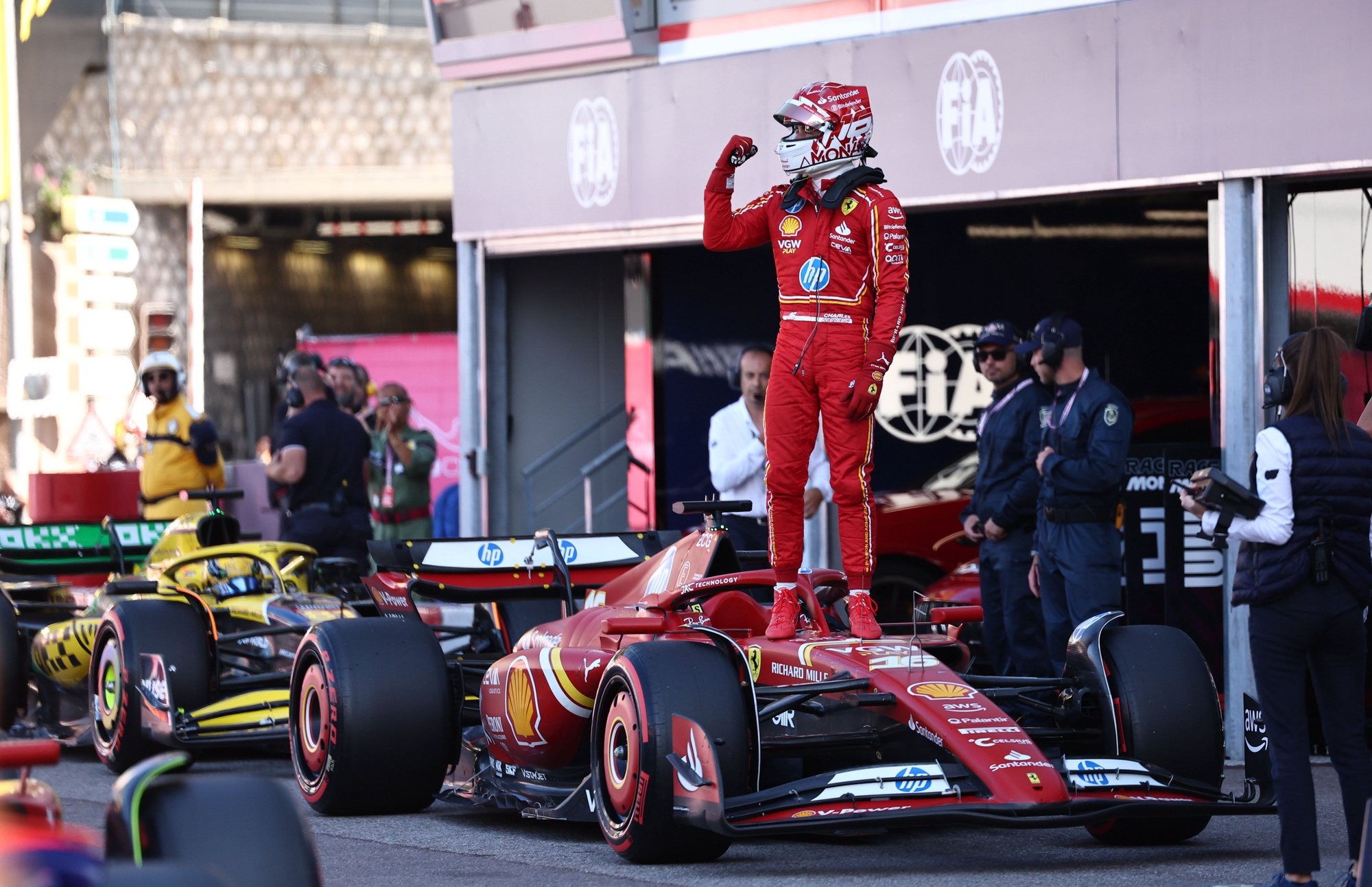 epa11368772 Scuderia Ferrari driver Charles Leclerc of Monaco celebrates after securing pole position in the Qualifying for the Formula One Grand Prix of Monaco, in Monte Carlo, Monaco, 25 May 2024. The Formula 1 Grand Prix of Monaco is held on the Circuit of Monaco on 26 May 2024.  EPA/ANNA SZILAGYI