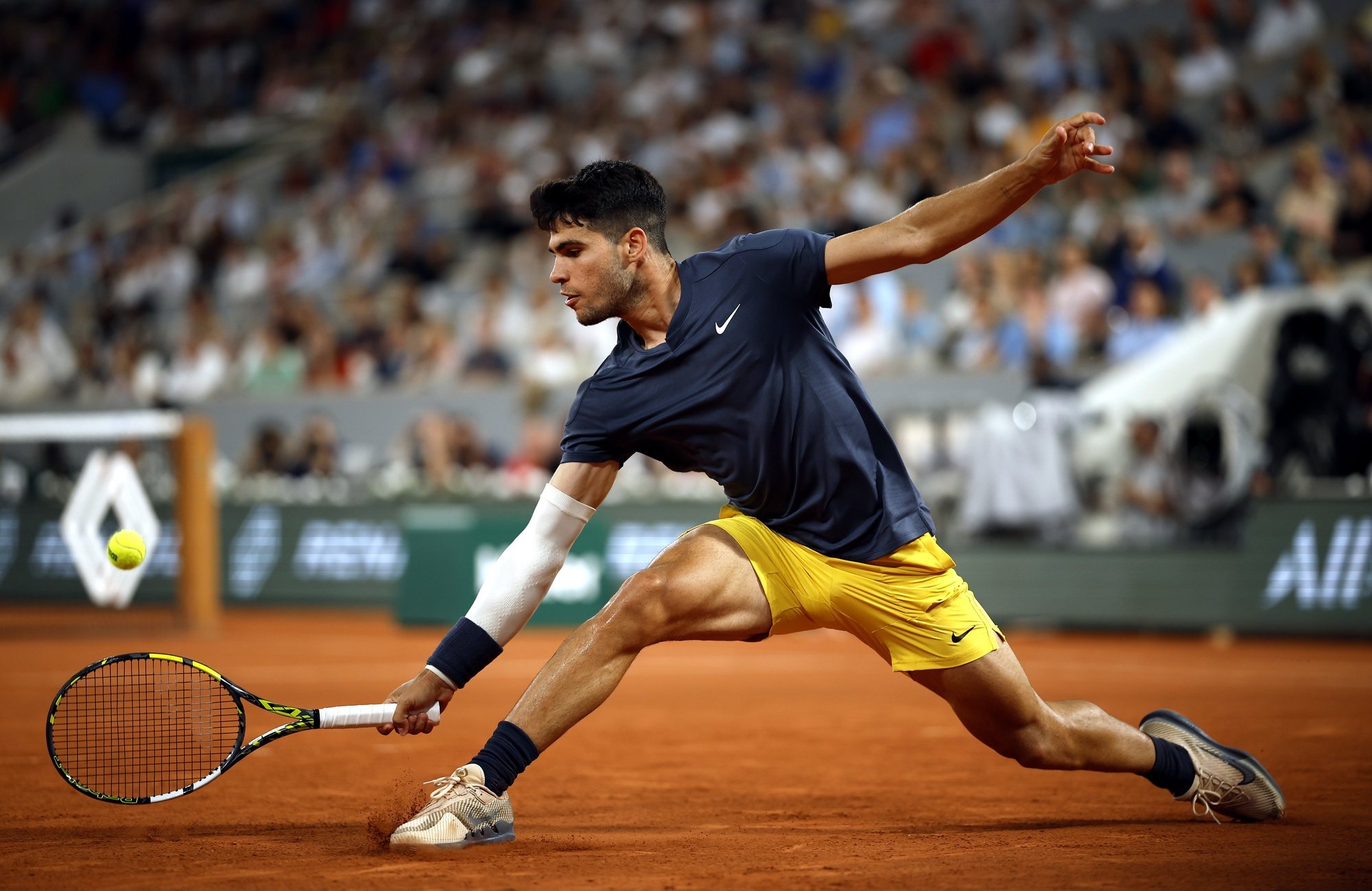 epa11371415 Carlos Alcaraz of Spain in action against Jeffrey Wolf of USA during their Men&#039;s Singles 1st round match during the French Open Grand Slam tennis tournament at Roland Garros in Paris, France, 26 May 2024.  EPA/YOAN VALAT