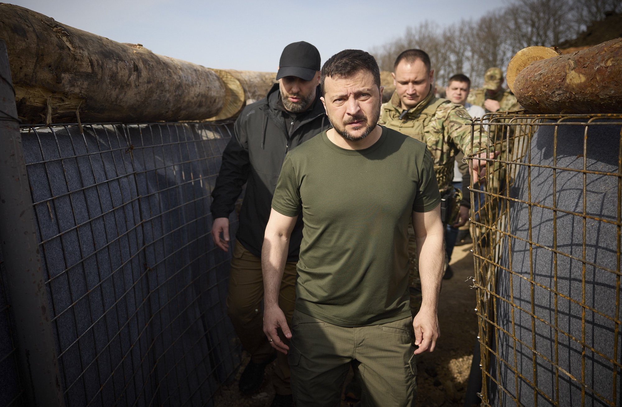 epa11267436 A handout photo made available by the Presidential Press Service shows Ukrainian President Volodymyr Zelensky (C) and the head of the Kharkiv Regional Military Administration Oleh Syniehubov (L background) visit the construction site of a defence line in the Kharkiv region, Ukraine, 09 April 2024 amid the Russian invasion. Russian troops entered Ukrainian territory on 24 February 2022, starting a conflict that has provoked destruction and a humanitarian crisis.  EPA/PRESIDENTIAL PRESS SERVICE HANDOUT HANDOUT  HANDOUT EDITORIAL USE ONLY/NO SALES HANDOUT EDITORIAL USE ONLY/NO SALES