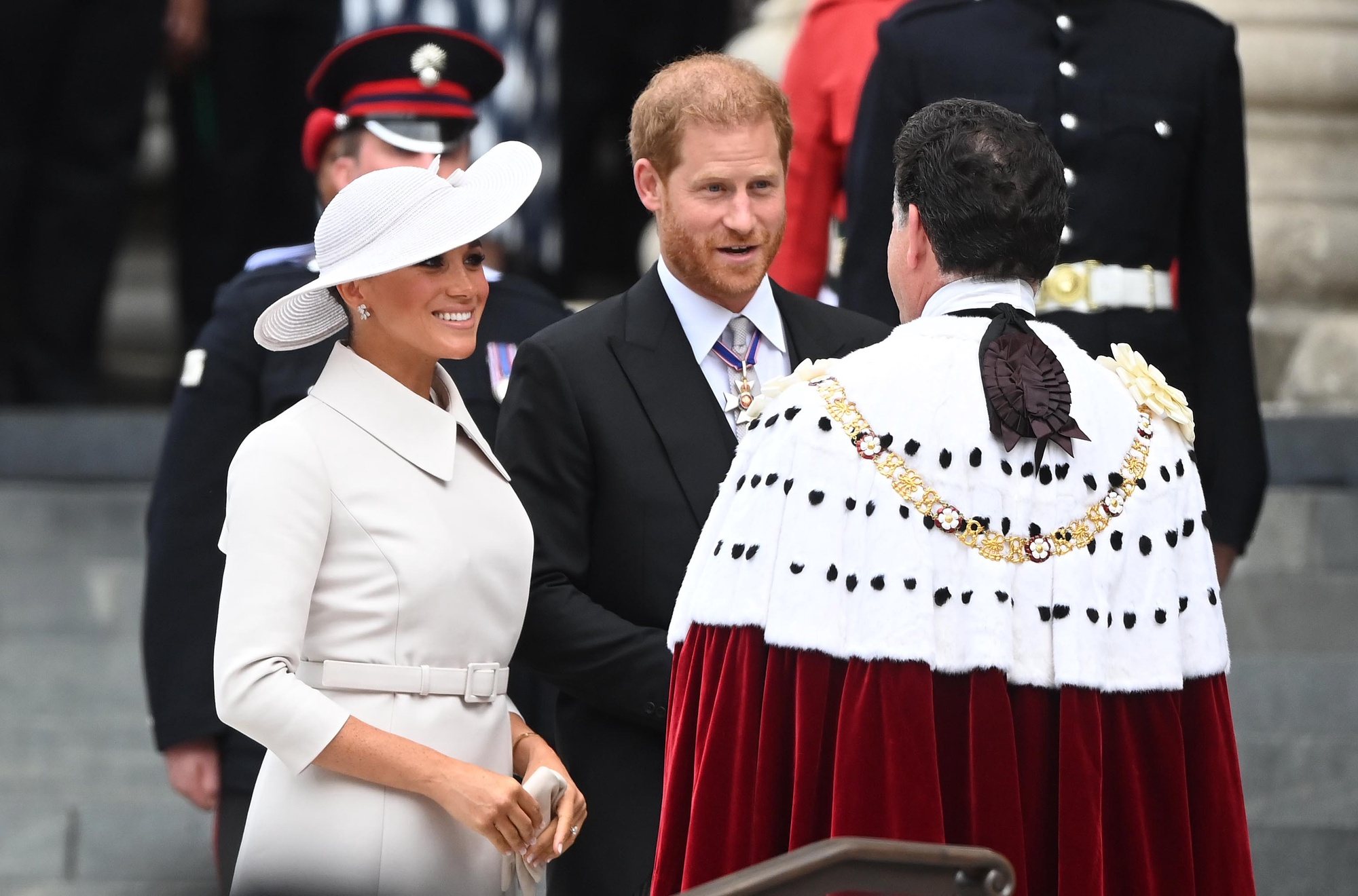 epa09993346 Meghan Markle (L), the Duchess of Sussex, and Prince Harry, The Duke of Sussex (C) arrive for the National Service of Thanksgiving as part of the celebrations of the Platinum Jubilee of Queen Elizabeth II, at St Paul&#039;s Cathedral in London, Britain, 03 June 2022. Queen Elizabeth II will not be attending the service after experiencing &#039;discomfort&#039;. The service celebrates the Queen&#039;s Platinum Jubilee, marking the 70th anniversary of her accession to the throne on 06 February 1952.  EPA/NEIL HALL