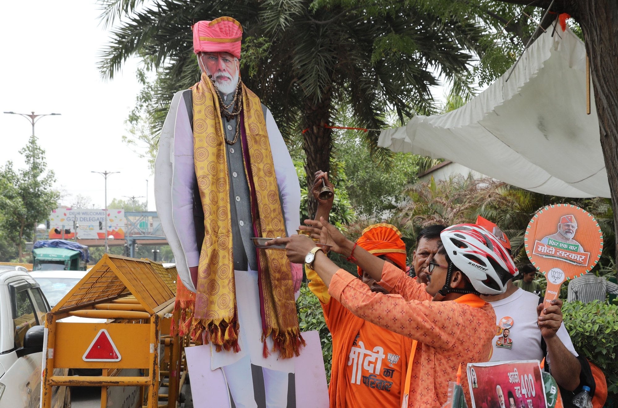 epa11388542 Bharatiya Janata Party (BJP) supporters celebrate their party&#039;s lead in the election results, with a cardboard cutout figure of Prime Minsiter Narendra Modi, at the BJP headquarters in New Delhi, India, 04 June 2024. Counting for the general election results has started for India&#039;s 545-member lower house of parliament, or Lok Sabha, with early trends showing the Bharatiya Janata Party and its National Democratic Alliance (NDA) leading.  EPA/RAJAT GUPTA