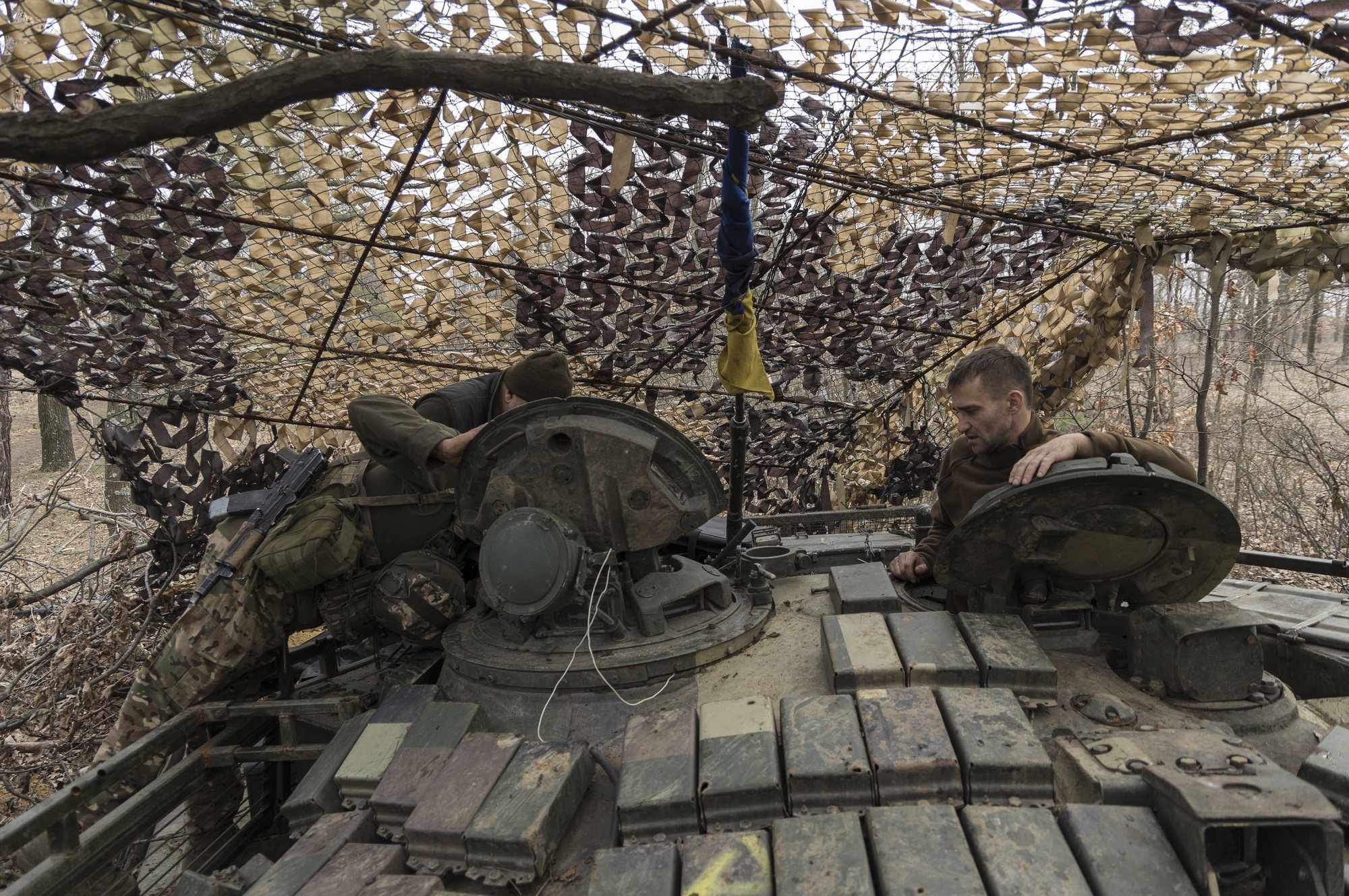 epa11225224 Servicemen of the 24th Mechanized Brigade of the Ukrainian Ground Forces inside a concealed tank at their position at a frontline in the Donetsk area, Ukraine, 16 March 2024 (issued 17 March 2024). Russian troops entered Ukraine in February 2022 starting a conflict that has provoked destruction and a humanitarian crisis.  EPA/YAKIV LIASHENKO