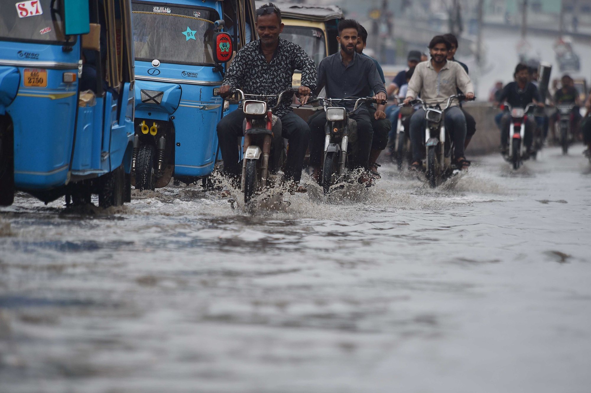 epa11278190 People ride motorcycles during heavy rain in Karachi, Pakistan, 14 April 2024. At least 29 people have died and another seven have been injured in the last two days due to lightning strikes and incidents related to the heavy rains affecting several provinces of Pakistan, rescue officials said. In total, 17 people died in the northeastern province of Punjab, in addition to eight deaths in southern Balochistan and four in northern Khyber Pakhtunkhwa.  EPA/SHAHZAIB AKBER