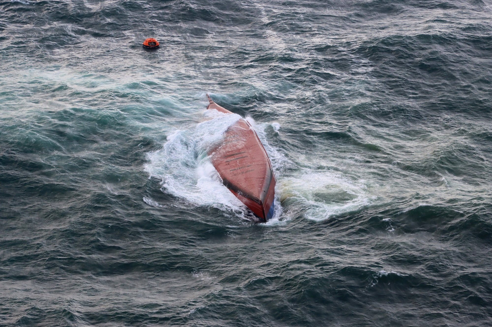 epa11230639 A handout photo made available by the Moji Coast Guard Office shows the South Korean-flagged chemical tanker, Keoyoung Sun, after it capsized off the coast of Shimonoseki, Yamaguchi Prefecture, western Japan, 20 March 2024. According to the Japan Coast Guard, nine of the 11 crew members were rescued by helicopter, of whom seven were later confirmed dead. Rescuers are still searching for two missing members.  EPA/MOJI COAST GUARD OFFICE HANDOUT  HANDOUT EDITORIAL USE ONLY/NO SALES HANDOUT EDITORIAL USE ONLY/NO SALES