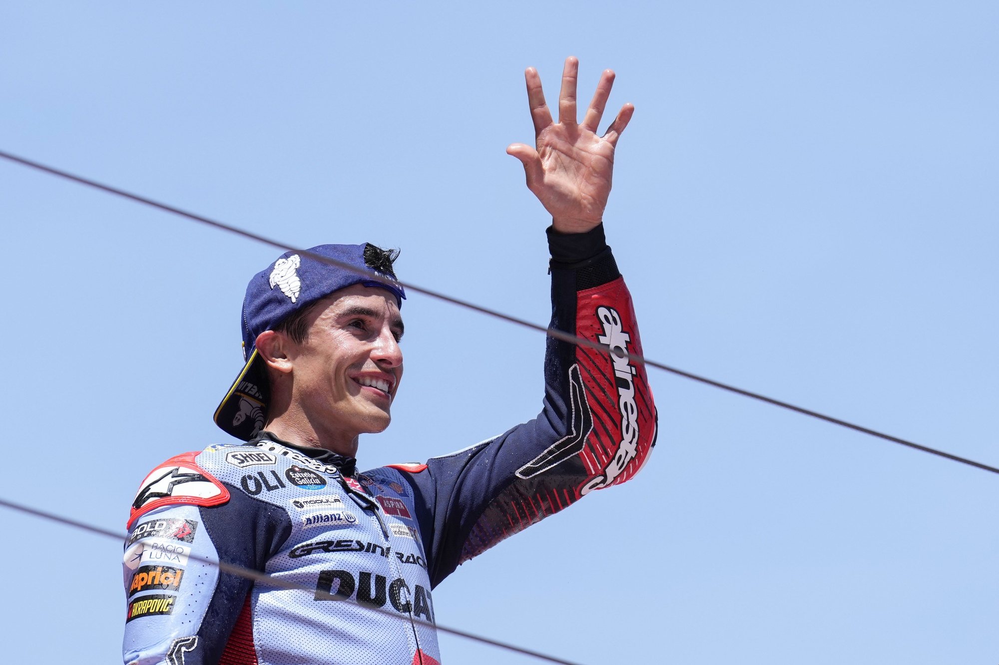 epa11371359 Spanish rider Marc Marquez celebrates after finishing third at the MotoGP race of the Catalonian Grand Prix at the Circuit de Barcelona-Catalunya (also known as Montmelo racetrack), in Montmelo, Spain, 26 May 2024.  EPA/ALEJANDRO GARCIA
