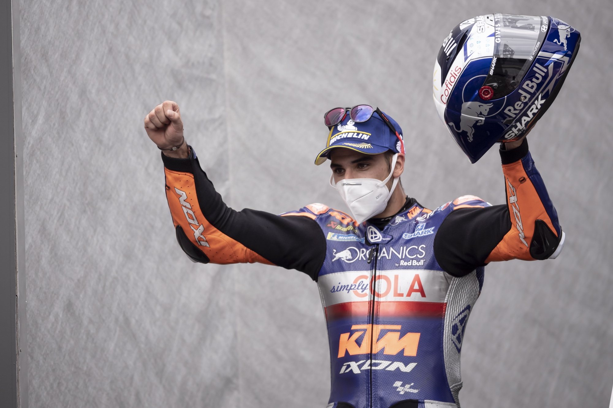 epa08619758 First placed Portuguese MotoGP rider Miguel Oliveira of Red Bull KTM Tech 3 celebrates on the podium after the Motorcycling Grand Prix of Styria at the Red Bull Ring in Spielberg, Austria, 23 August 2020.  EPA/CHRISTIAN BRUNA