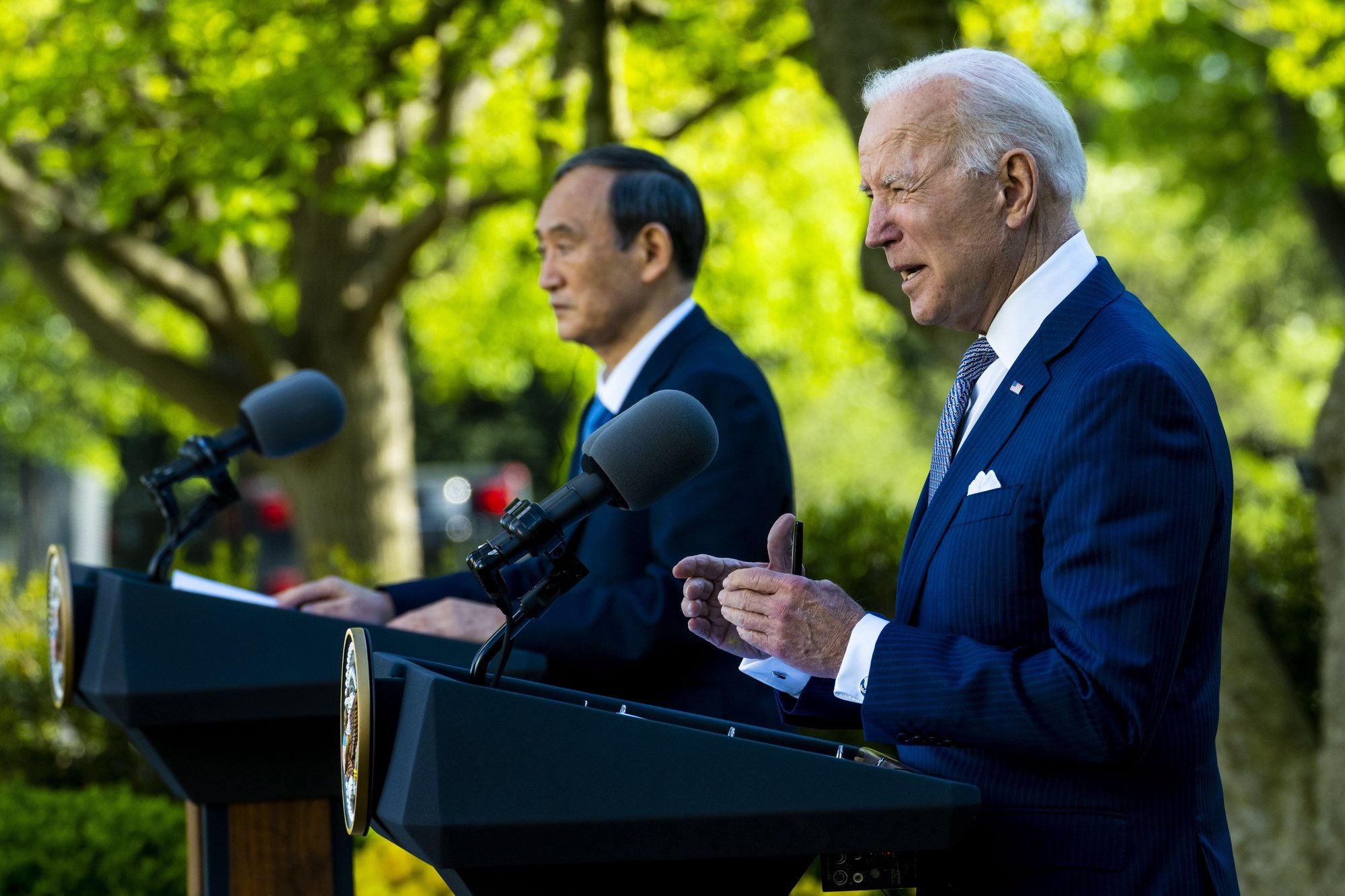 epa09140453 US President Joe Biden (R) and Prime Minister of Japan Suga Yoshihide (L) during a joint news conference at the White House, in Washington, DC, USA, 16 April 2021.  EPA/Doug Mills / POOL