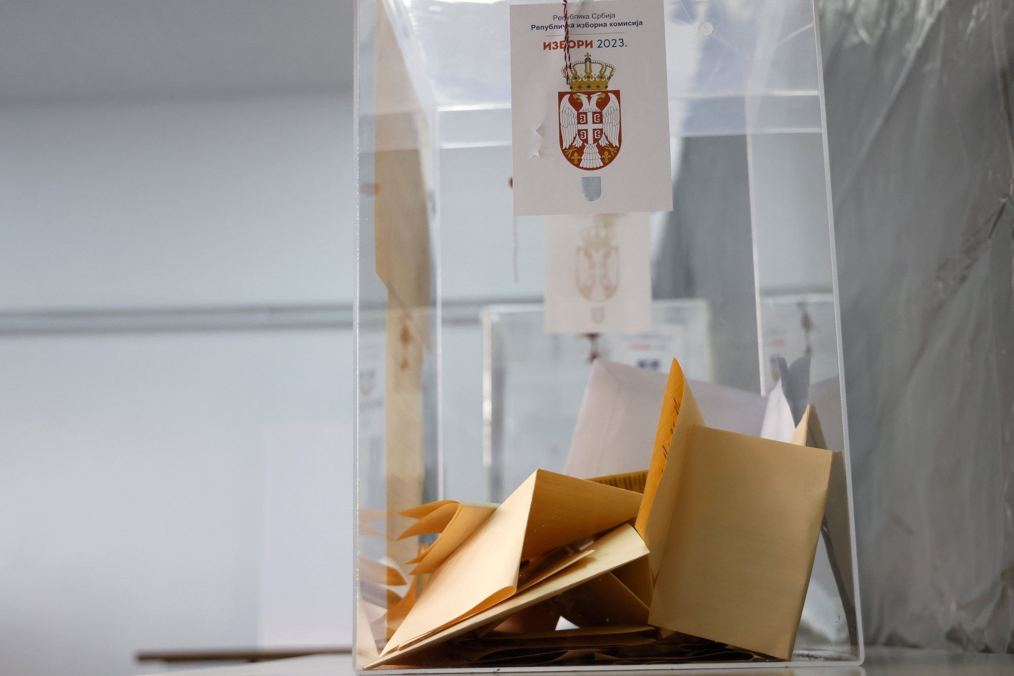 epa11033677 Ballots are seen inside a ballot box during the Parliamentary and local elections in Belgrade, Serbia, 17 December 2023. Voters in Serbia will elect a new parliament and local authorities in 64 municipalities on 17 December 2023.  EPA/MARKO DJOKOVIC