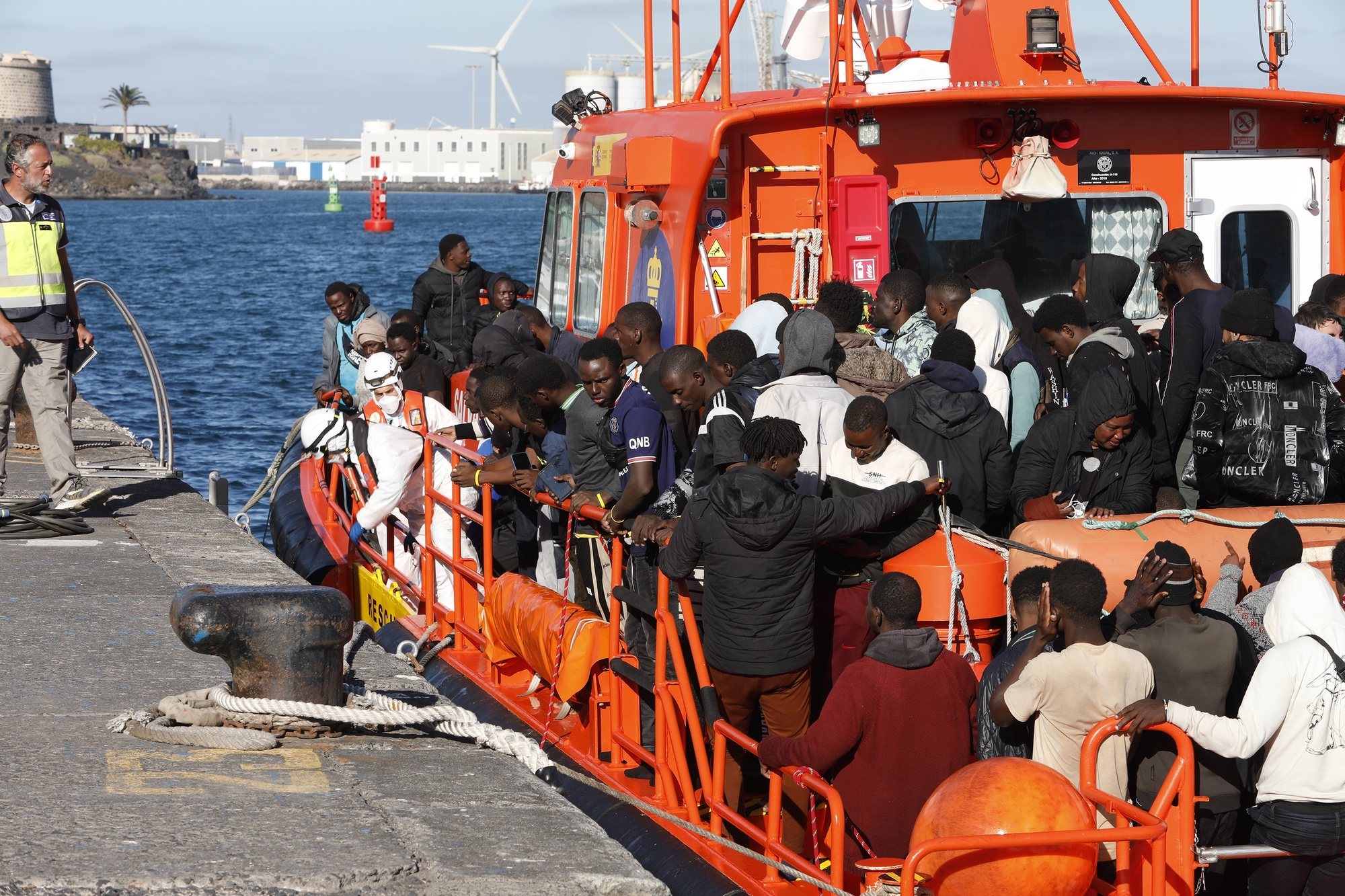 epa11222949 Migrants rescued by the Spanish Salvamento Maritimo arrive at the port of Arrecife in Lanzarote, Canary Islands, Spain, 15 March 2024. A total of 111 migrants were rescued when they traveled on board two small boats trying to reach the Spanish coast.  EPA/Adriel Perdomo