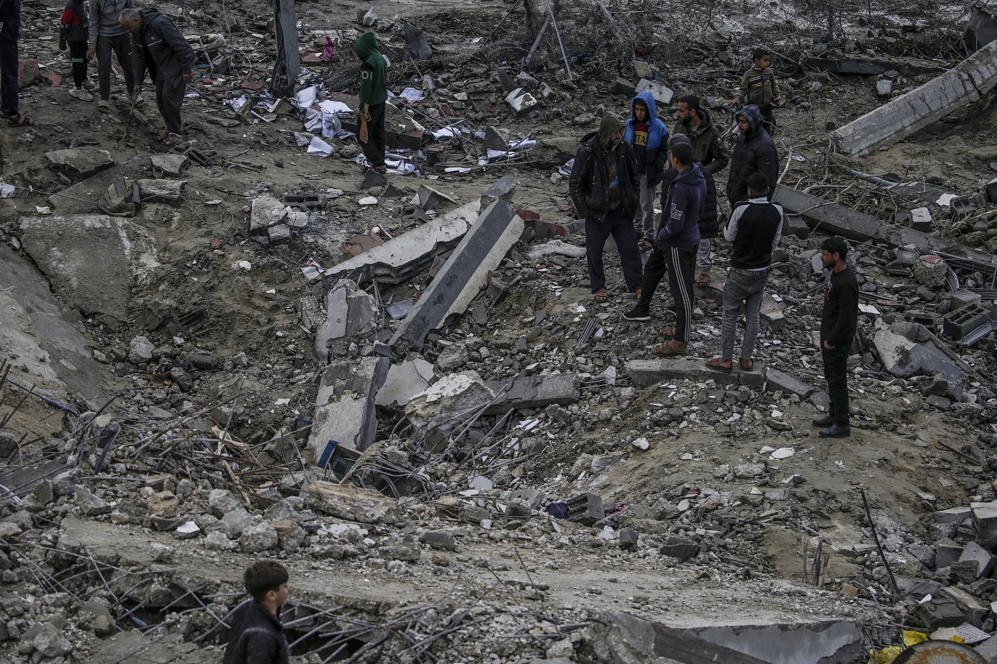epa11229019 Palestinians search for missing people under the rubble of the destroyed house of the Al Hajj family following an Israeli air strike, in Al Nusairat refugee camp, southern Gaza Strip, 19 March 2024. According to the Palestinian Ministry of Health, more than 10 members of the same family were killed and six remain trapped under the rubble following an overnight Israeli air strike. More than 31,500 Palestinians and over 1,300 Israelis have been killed, according to the Palestinian Health Ministry and the Israel Defense Forces (IDF), since Hamas militants launched an attack against Israel from the Gaza Strip on 07 October 2023, and the Israeli operations in Gaza and the West Bank which followed it.  EPA/MOHAMMED SABER