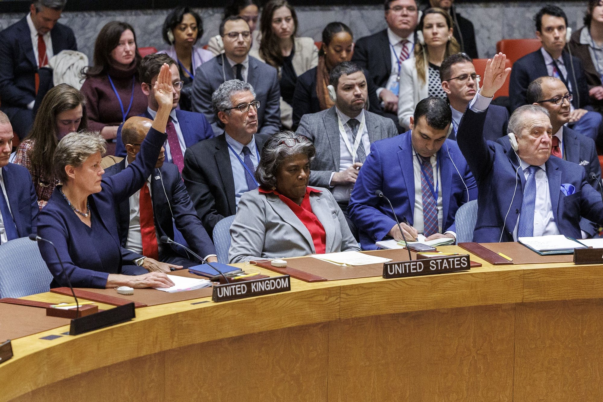 epa11242910 Ambassadors, except for United States Ambassador Linda Thomas-Greenfield (C), raise their hands to vote in favor of a resolution calling for an immediate ceasefire in Gaza, during a United Nations Security Council meeting at the United Nations Headquarters in New York, USA, 25 March 2024. The resolution passed with 14 members voting in favor while the US absteined from the vote.  EPA/SARAH YENESEL