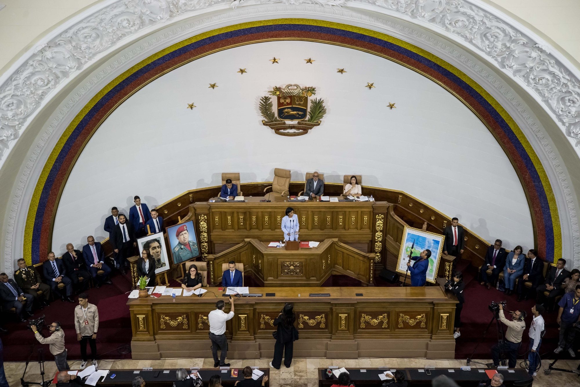 epa11256323 Vice President of Venezuela, Delcy Rodriguez (C),  participates in a session of the chamber of sessions of the federal legislative palace in the chamber at the Federal Legislative Palace in Caracas, Venezuela, 02 April 2024. The Government of Venezuela presented to the National Assembly (AN, Parliament), controlled by Chavismo, the &#039;bill against fascism, neo-fascism and similar expressions&#039; prepared by order by the head of state, Nicolas Maduro. The document presented by Delcy Rodriguez, includes four chapters and 30 articles, and establishes &quot;means and mechanisms to preserve peaceful coexistence, public tranquility, the democratic exercise of the popular will, the recognition of diversity, the tolerance and reciprocal respect, in the face of fascist attacks.  EPA/Miguel Gutierrez