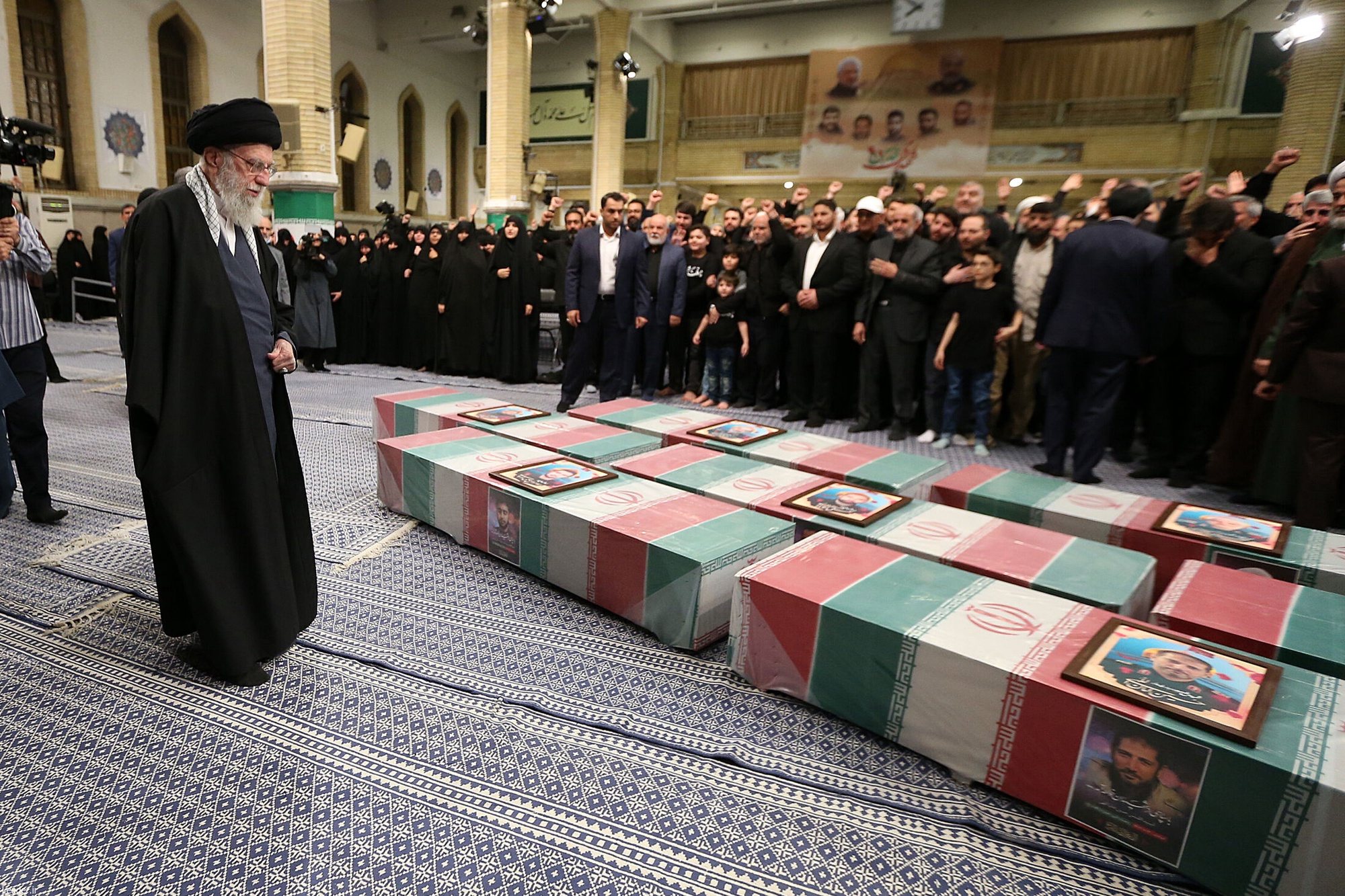 epa11259284 A handout photo made available by the Iranian supreme leader office shows Iranian Supreme Leader Ayatollah Ali Khamenei (L) praying over the coffins of members of the Iranian revolutionary guards corps (IRGC) who were killed in Syria, ahead of their funeral in Tehran, Iran, 04 April 2024. According to Iranian state media quoting the Islamic Revolutionary Guard Corps, at least seven IRGC military advisors, including two generals, were killed in an airstrike on the Iranian consulate building in Syria&#039;s capital Damascus on 01 April. Iran has blamed Israel for the attack and vowed to respond. Iranians will hold a funeral ceremony for them on 05 April 2024.  EPA/IRANIAN SUPREME LEADER OFFICE / HANDOUT  HANDOUT EDITORIAL USE ONLY/NO SALES HANDOUT EDITORIAL USE ONLY/NO SALES