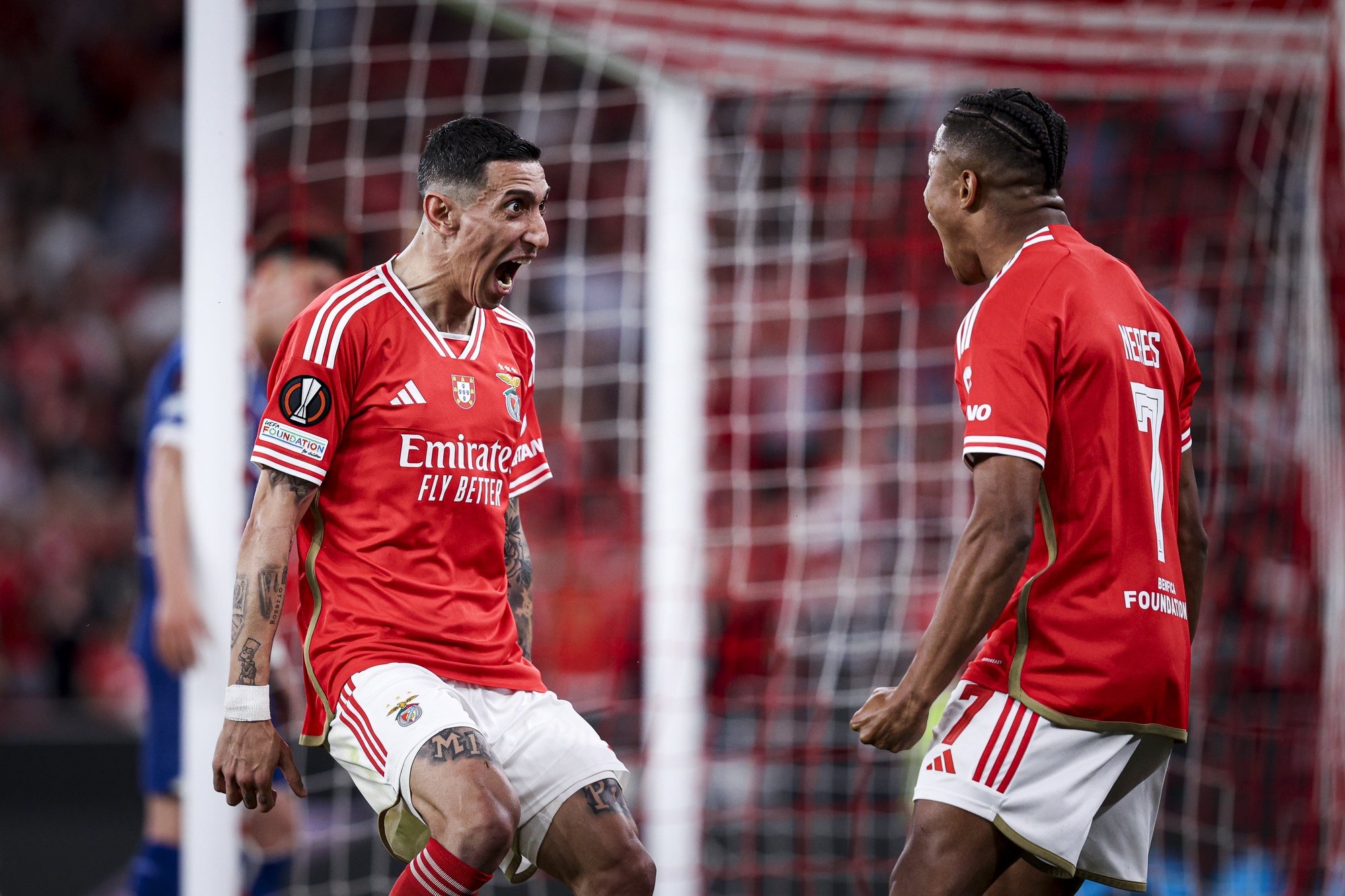 Benfica player Di Maria (L) celebrates with Benfica player David Neres after scoring a goal during the UEFA Europe League quarter-final first leg soccer match between Benfica and Olympique de Marseille held at Luz Stadium, in Lisbon, Portugal, 11 April 2024. FILIPE AMORIM/LUSA
