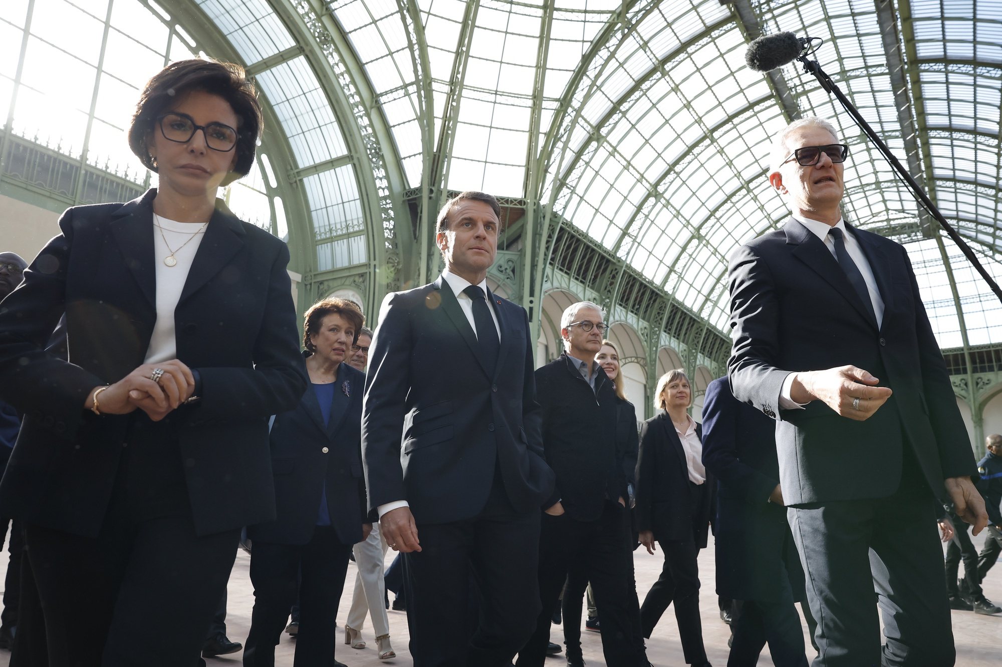 epa11279435 French President Emmanuel Macron (C) walks next to President of the Grand Palais Didier Fusillier (R) and  Minister of Culture of France Rachida Dati (L) during his visit at the Grand Palais 100 days ahead of the Paris 2024 Olympic Games in Paris, France, 15 April 2024. The 2024 Summer Olympics are held in Paris from 26 July to 11 August 2024, and the Grand Palais will host Fencing and Taekwondo.  EPA/YOAN VALAT / POOL