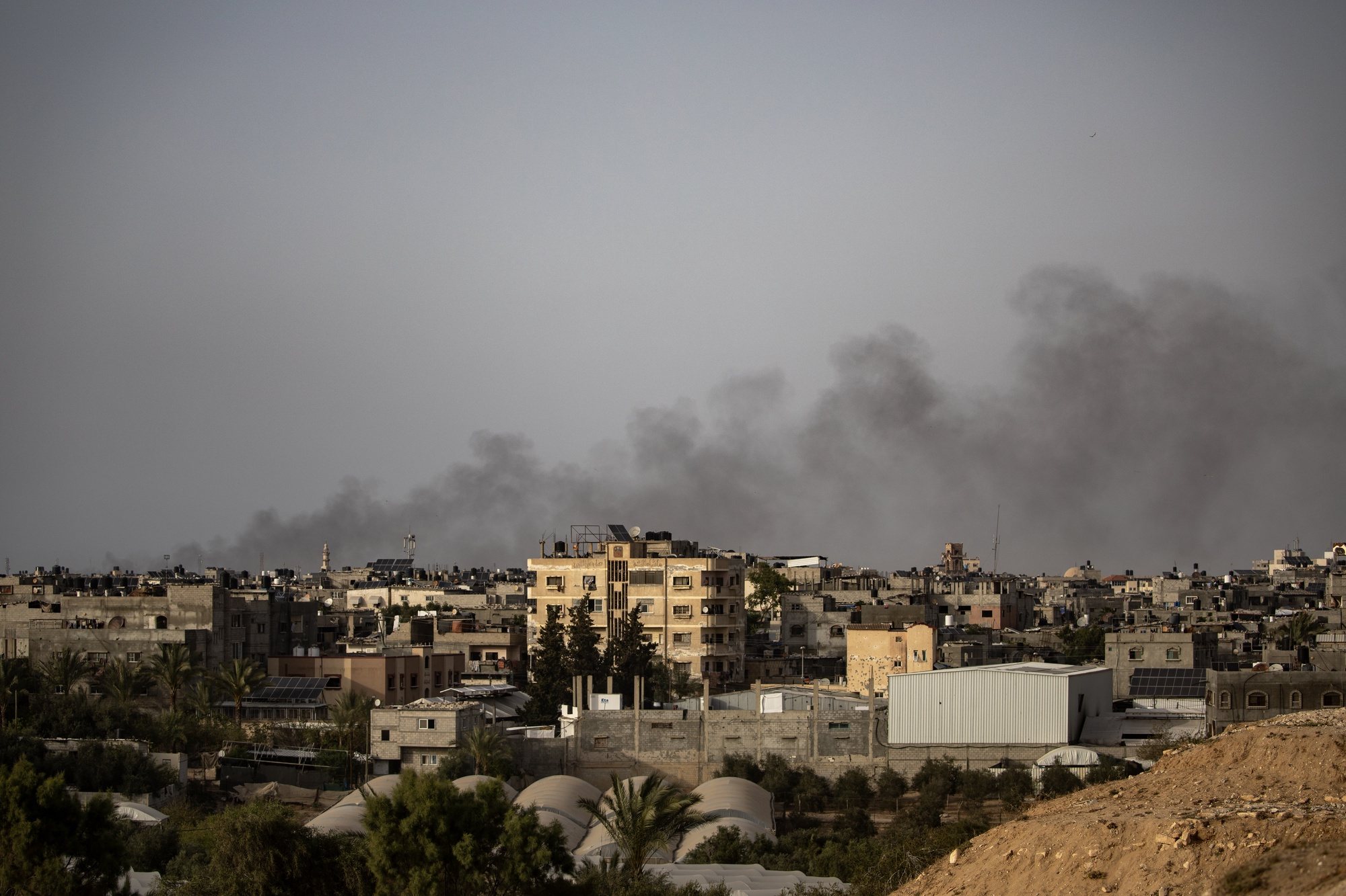 epa11290475 Smoke rises from Rafah refugee camp, in Rafah, southern Gaza Strip, 20 April 2024, after an Israeli air strike. More than 34,000 Palestinians and over 1,450 Israelis have been killed, according to the Palestinian Health Ministry and the Israel Defense Forces (IDF), since Hamas militants launched an attack against Israel from the Gaza Strip on 07 October 2023, and the Israeli operations in Gaza and the West Bank which followed it.  EPA/HAITHAM IMAD