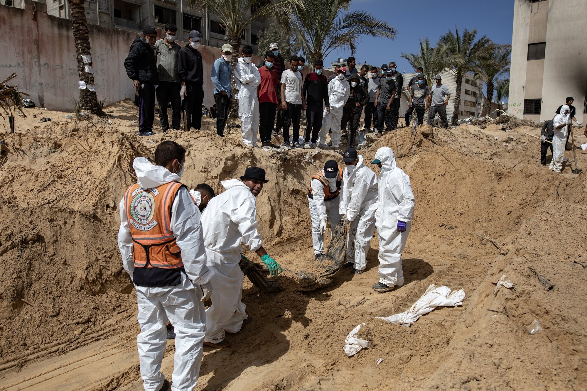 epa11291334 The Palestinian Civil Defense recovers 50 bodies from what they are calling a mass grave inside Nasser Hospital in Khan Yunis, Gaza April 21, 2024. More than 34,000 Palestinians and over 1,450 Israelis have been killed, according to the Palestinian Health Ministry and the Israel Defense Forces (IDF), since Hamas militants launched an attack against Israel from the Gaza Strip on 07 October 2023, and the Israeli operations in Gaza and the West Bank which followed it.  EPA/HAITHAM IMAD
