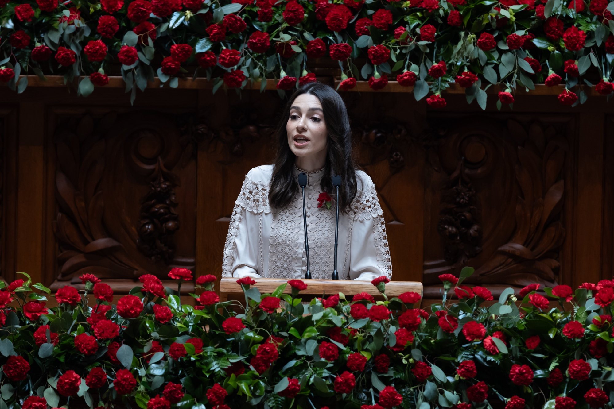 Portuguese Socialist Party (PS) deputy, Ana Gabriela Cabilhas, delivers a speech as Portuguese President, Marcelo Rebelo de Sousa (C), looks on during the solemn comemorative session at the Portuguese parliament in Lisbon, Portugal, 25 April 2024. Portugal celebrates the 50th anniversary of the Carnation Revolution that ended the authoritarian regime of Estado Novo (New State) that ruled the country between 1926 to 1974. JOSE SENA GOULAO/LUSA