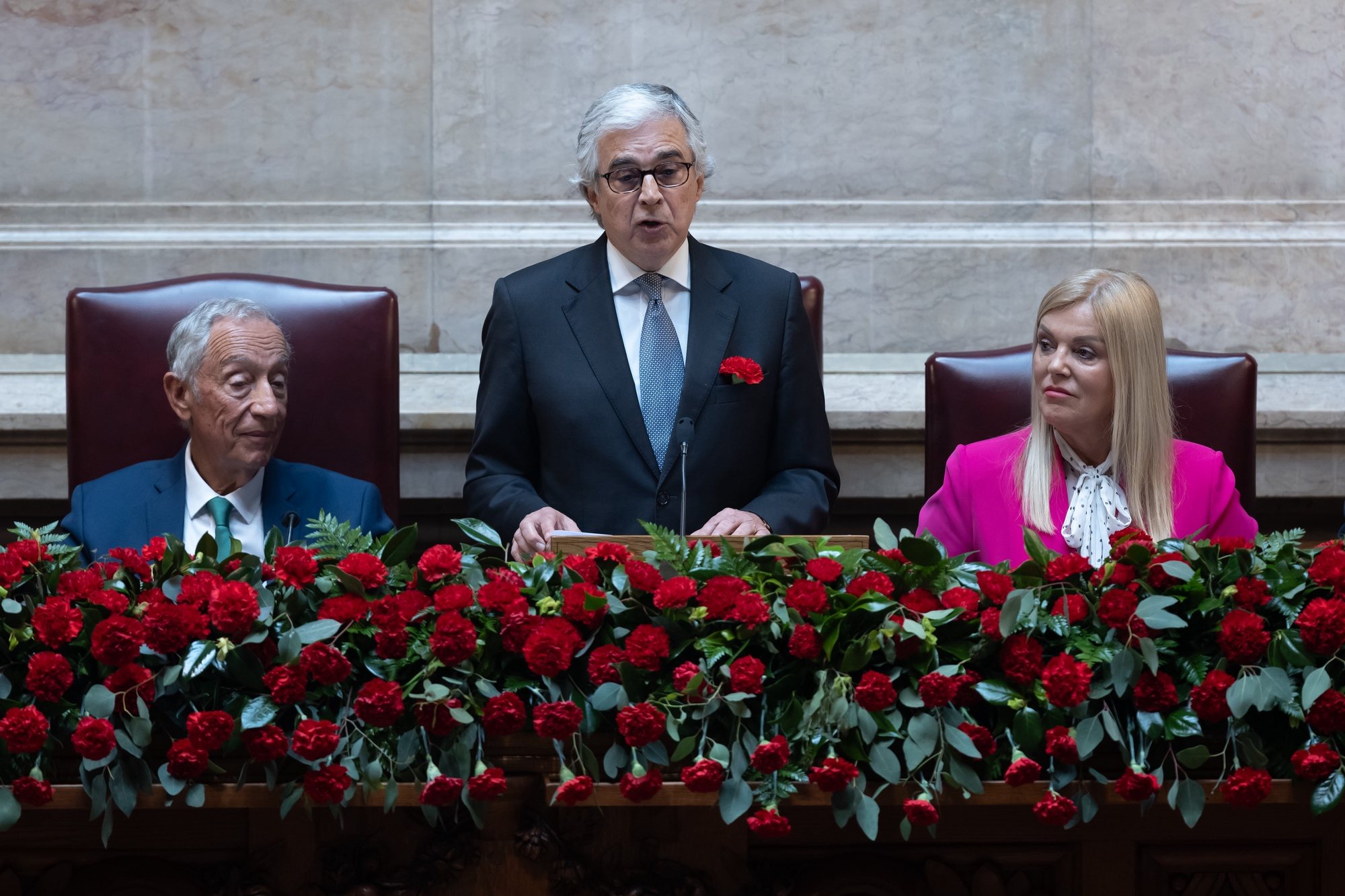 Portuguese president of the parliament, Jose Pedro Aguiar Branco (C), flanked by the Portuguese President, Marcelo Rebelo de Sousa, delivers a speech during the solemn comemorative session at the Portuguese parliament in Lisbon, Portugal, 25 April 2024. Portugal celebrates the 50th anniversary of the Carnation Revolution that ended the authoritarian regime of Estado Novo (New State) that ruled the country between 1926 to 1974. JOSE SENA GOULAO/LUSA