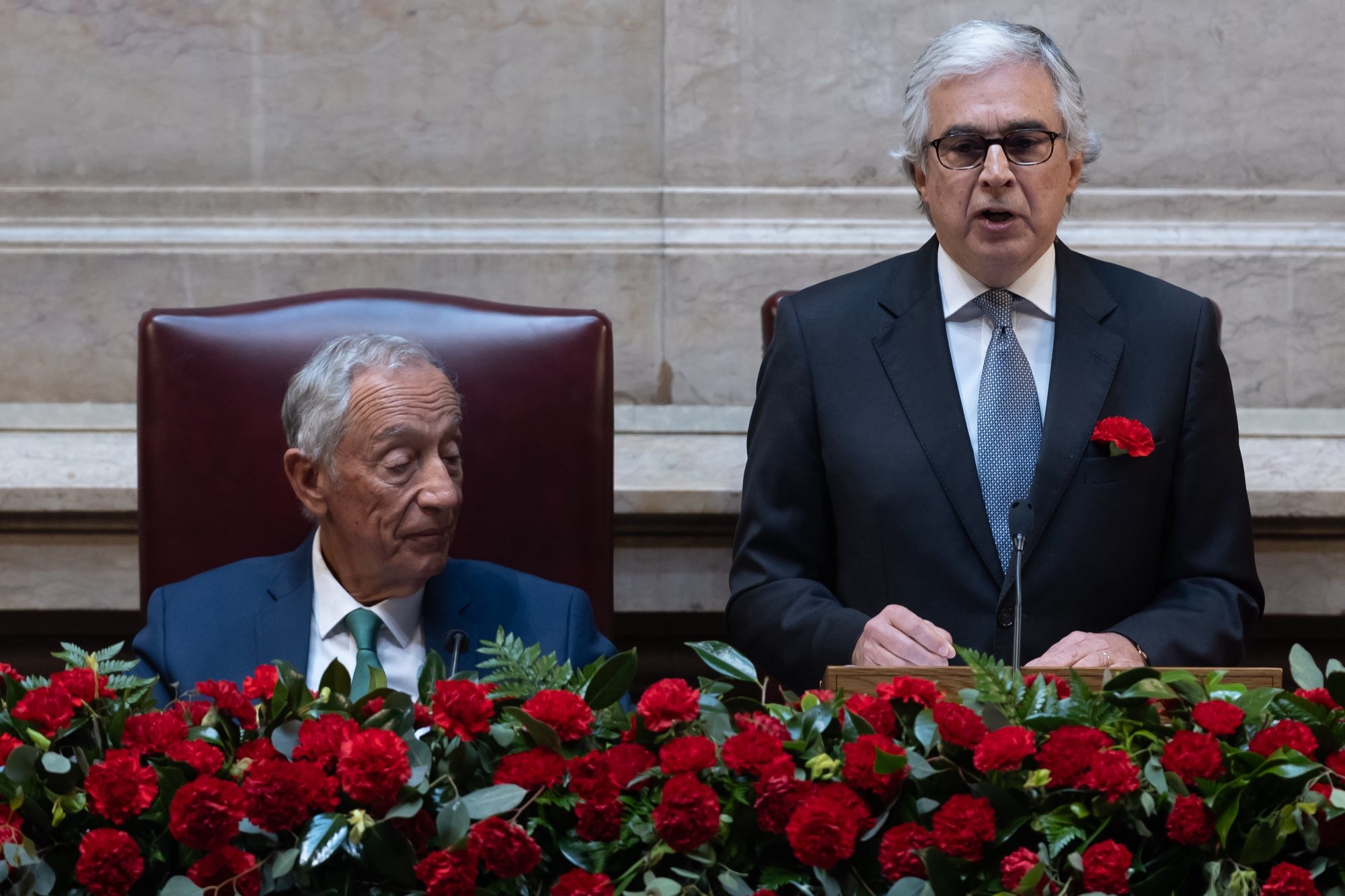 Portuguese president of the parliament, Jose Pedro Aguiar Branco, flanked by the Portuguese President, Marcelo Rebelo de Sousa, delivers a speech during the solemn comemorative session at the Portuguese parliament in Lisbon, Portugal, 25 April 2024. Portugal celebrates the 50th anniversary of the Carnation Revolution that ended the authoritarian regime of Estado Novo (New State) that ruled the country between 1926 to 1974. JOSE SENA GOULAO/LUSA
