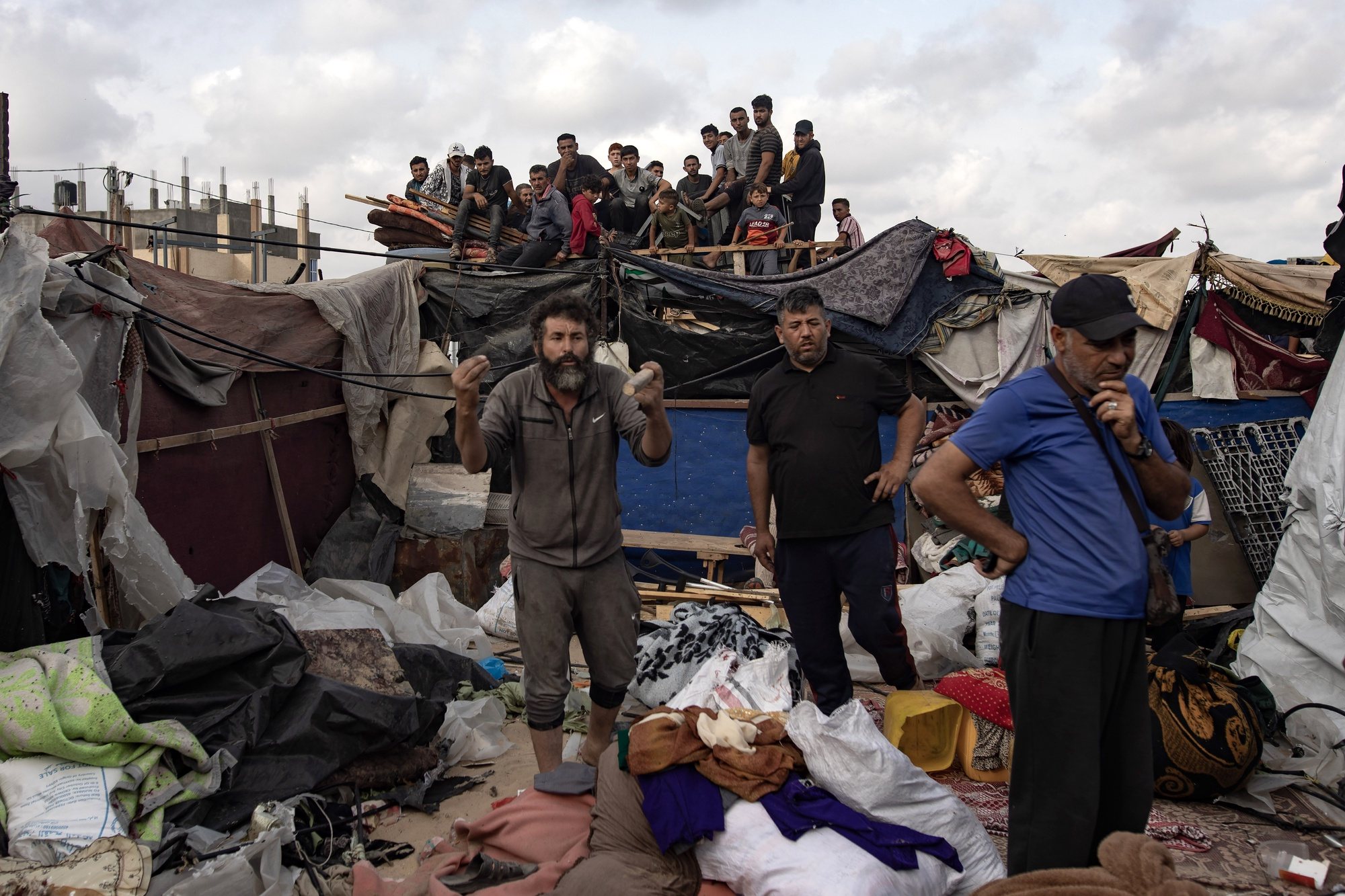 epa11375279 Palestinians inspect their tents after an Israeli army operation on an area previously designated by the Israeli army as safe for displaced Palestinians, in Rafah, southern Gaza Strip, 28 May 2024. More than 36,000 Palestinians and over 1,400 Israelis have been killed, according to the Palestinian Health Ministry and the Israel Defense Forces (IDF), since Hamas militants launched an attack against Israel from the Gaza Strip on 07 October 2023, and the Israeli operations in Gaza and the West Bank which followed it.  EPA/HAITHAM IMAD