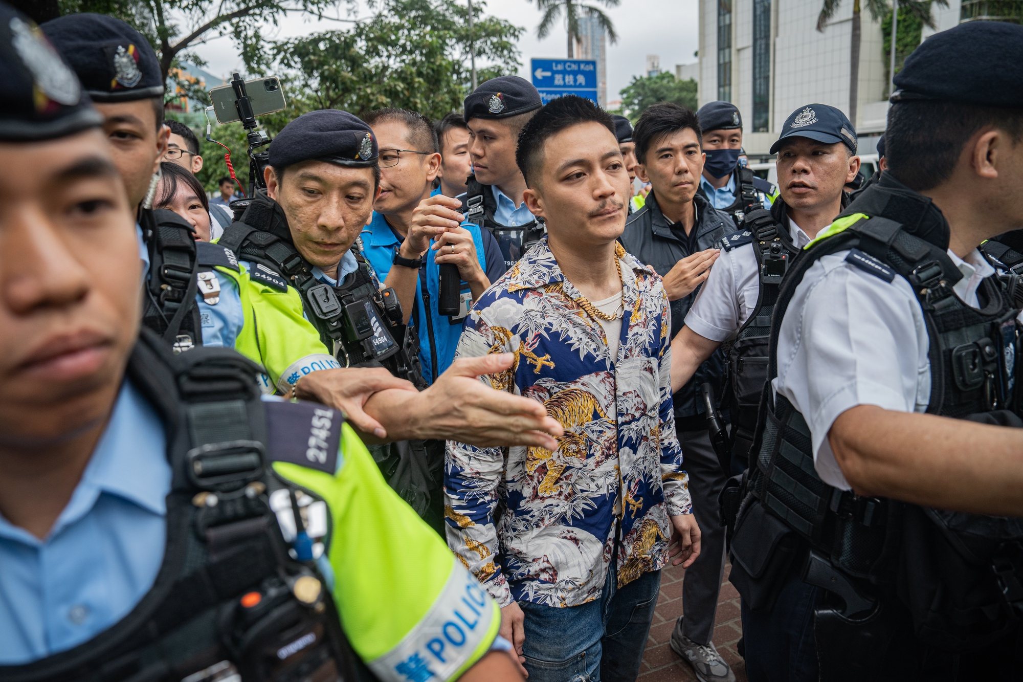 epa11378805 Lee Yu-shun (C), a former pro-democracy district councilor, leaves the West Kowloon Magistrates&#039; Courts during a break in Hong Kong, China, 30 May 2024. A court in Hong Kong on 30 May convicted 14 defendants over &#039;conspiracy to subvert the state power&#039; under the national security law, while two were acquitted, in trial of 47 prominent pro-democracy figures in Hong Kong arrested and charged in 2021.  EPA/LEUNG MAN HEI