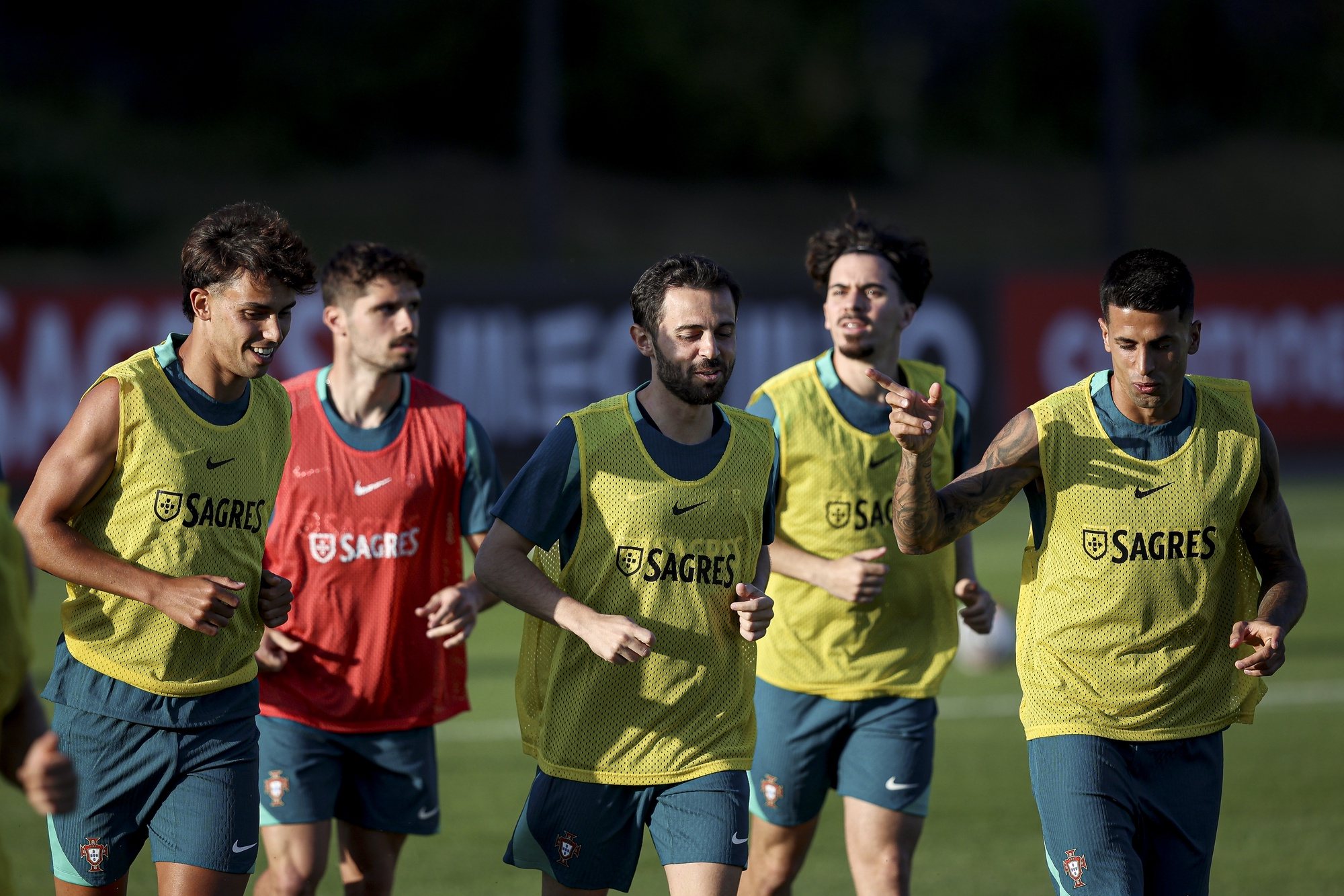 Portugal national team players Joao Felix (L), Bernardo Silva (C) and Joao Cancelo attend a training session at Cidade do Futebol in Oeiras, Portugal, 02 June 2024. Portugal will play friendly matches against Finland, Croatia and Ireland in preparation for the upcoming Euro 2024. FILIPE AMORIM/LUSA