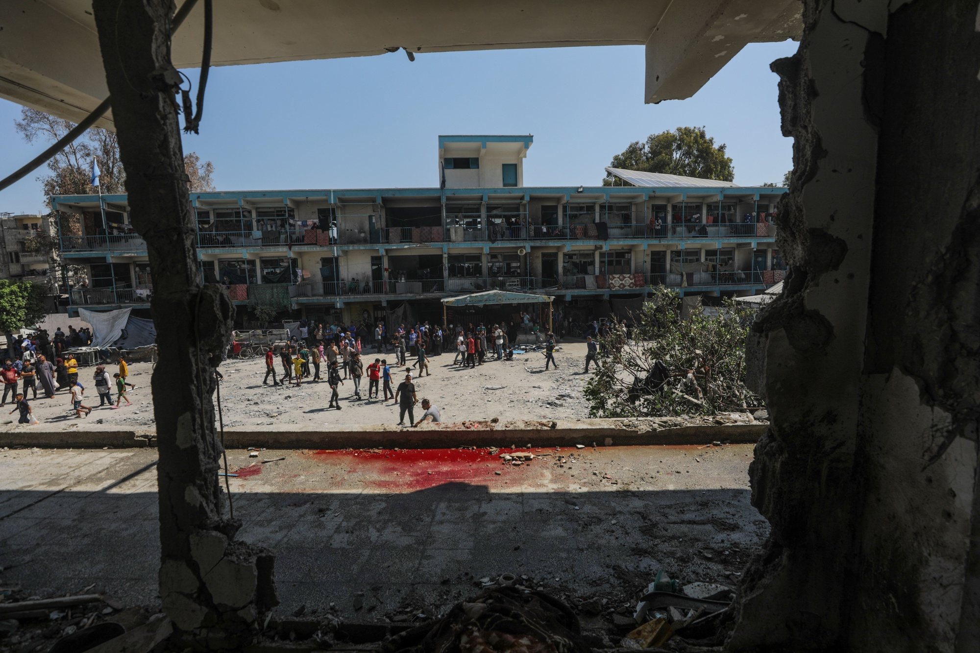 epa11392776 Palestinians inspect a destroyed UNRWA school following an Israeli air strike in Al Nusairat refugee camp in the central Gaza Strip, 06 June 2024. According to the Palestinian News Agency Wafa, at least 32 people  were killed and dozens others were injured on early 06 June following an Israeli strike on a UNRWA school sheltering displaced Palestinians, located in the Nuseirat refugee camp in the central Gaza strip. The Israeli army said that it had &quot;conducted a precise strike on a Hamas compound&quot;, whose members were &quot; embedded in the UNRWA school&quot;.  More than 36,000 Palestinians and over 1,400 Israelis have been killed, according to the Palestinian Health Ministry and the Israel Defense Forces (IDF), since Hamas militants launched an attack against Israel from the Gaza Strip on 07 October 2023, and the Israeli operations in Gaza and the West Bank which followed it.  EPA/MOHAMMED SABER