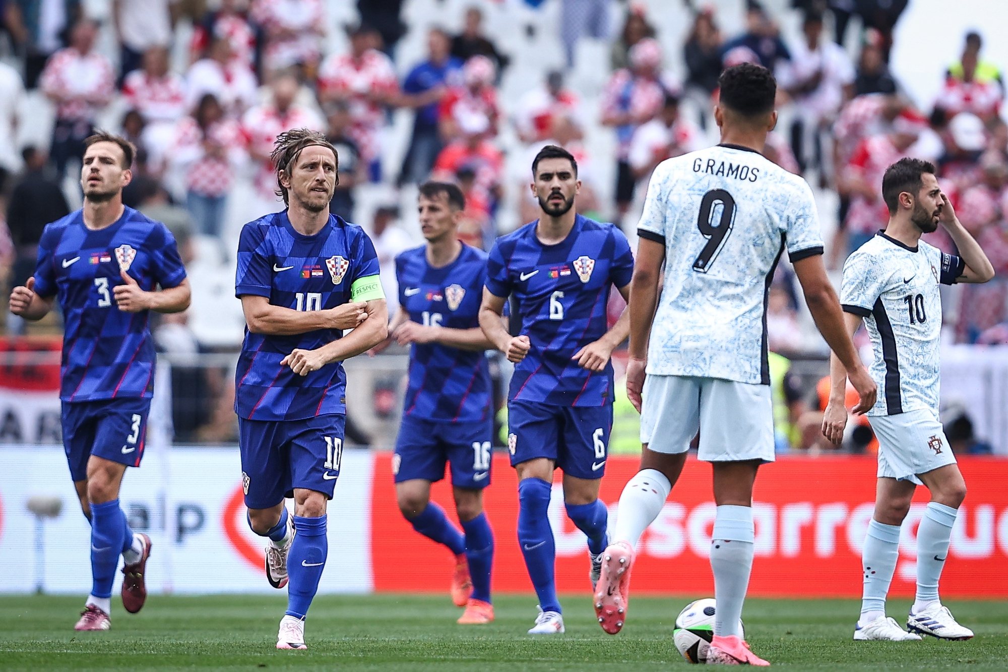Croatia player Luka Modric (2-L)  celebrates after scoring a penalty goal against Portugal during the international friendly soccer match, in Oeiras, Portugal, 08 June 2024. RODRIGO ANTUNES/LUSA