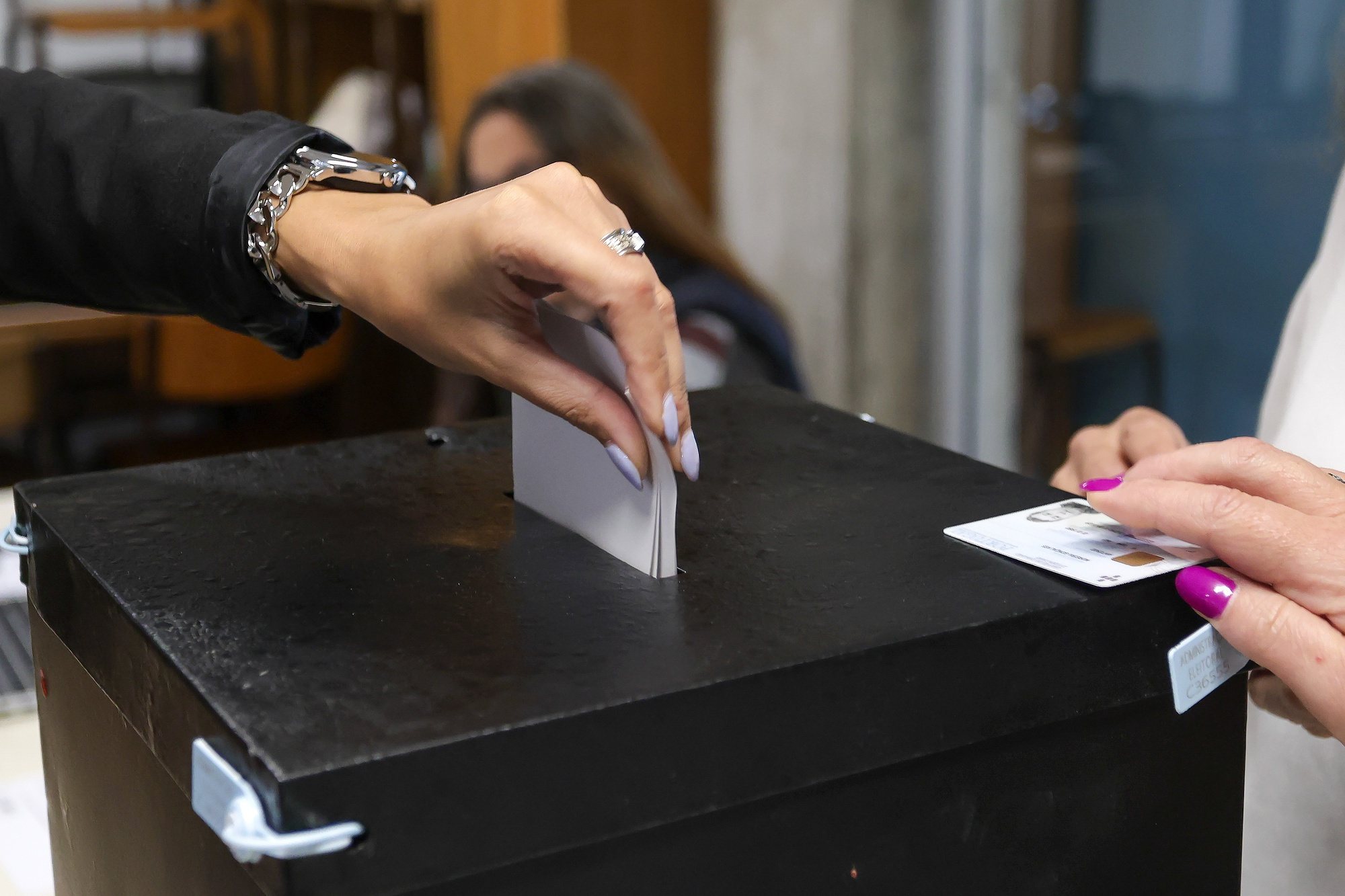 A citizen casting her ballot for the European Elections at a polling station in Porto, Portugal, 09 June 2024. More than 10.8 million registered voters in Portugal and abroad go to the polls today to choose 21 of the 720 members of the European Parliament. MANUEL FERNANDO ARAUJO/LUSA
