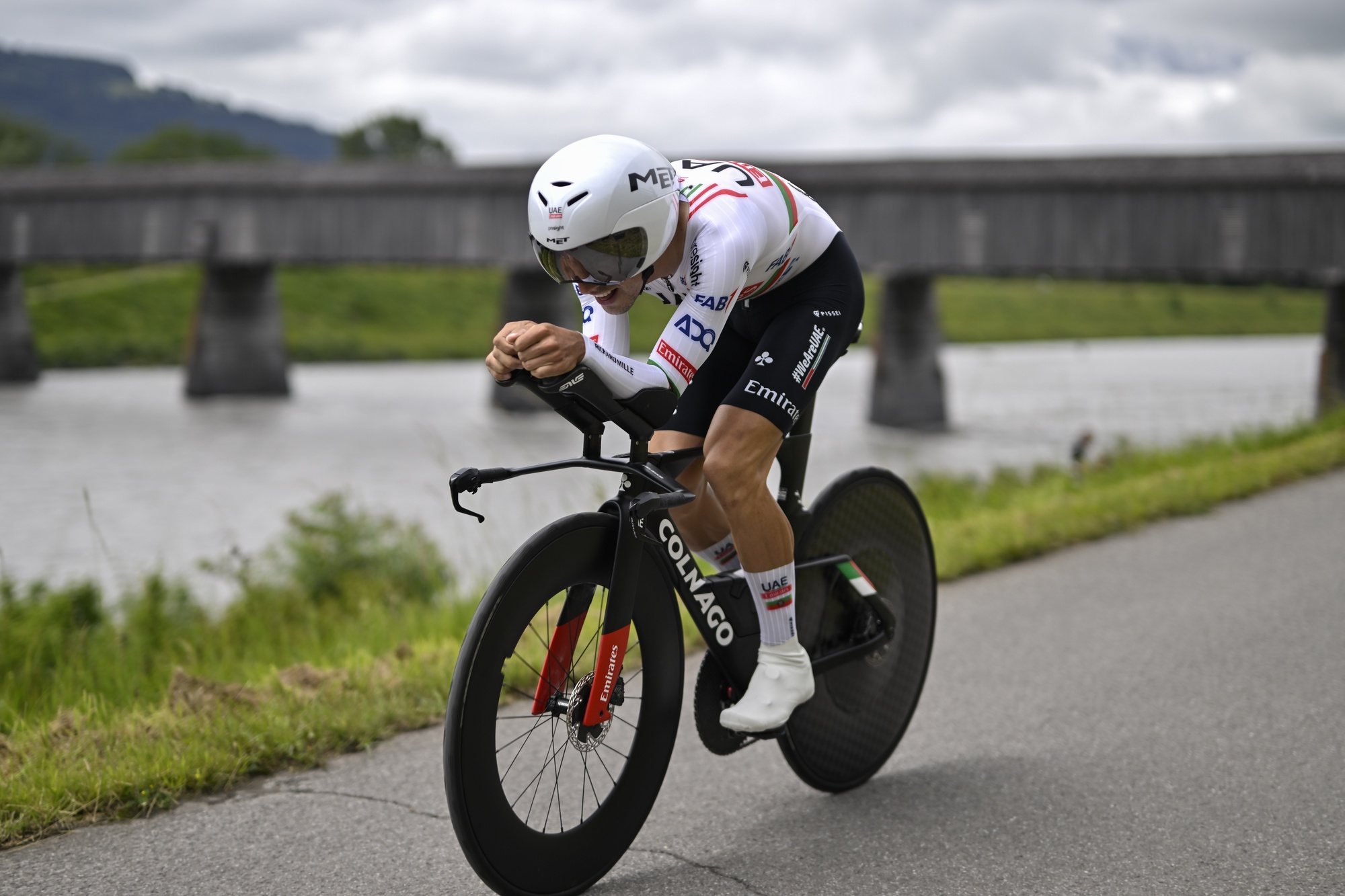 epa11400228 Joao Almeida from Portugal of UAE Team Emirates in action during the first stage of the 87th Tour de Suisse cycling race, an individual time trial over 4.8 km with start and finish in Vaduz, Liechtenstein, 09 June 2024.  EPA/GIAN EHRENZELLER