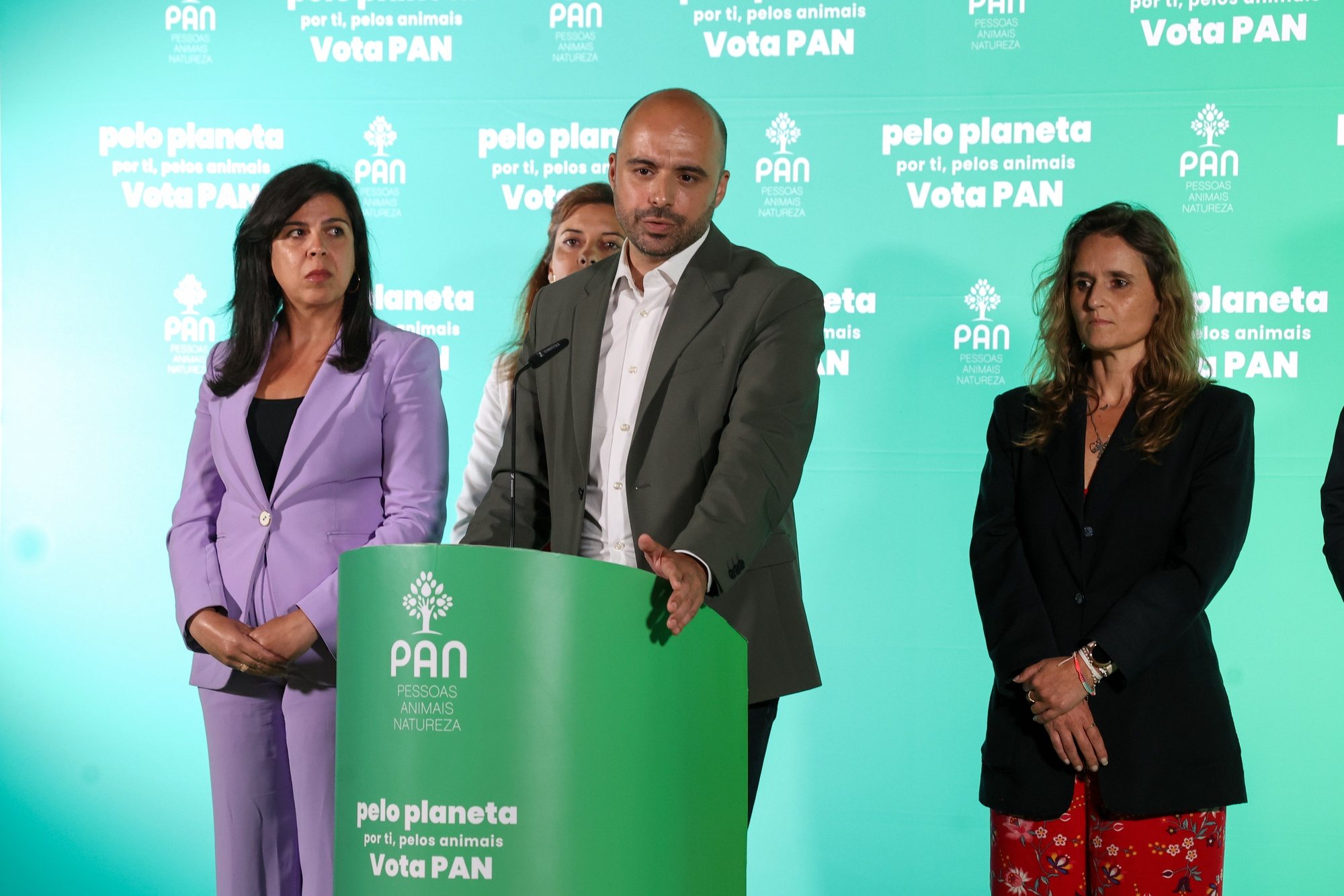 People–Animals–Nature (PAN) candidate Pedro Fidalgo Marques (C) accompanied by the Leader of People-Animals-Nature (PAN) Ines de Sousa Real (L) speaks at the party electoral headquarters after knowing the results of the European elections night in Lisbon, Portugal, 09 June 2024. More than 10.8 million registered voters in Portugal and abroad go to the polls today to choose 21 of the 720 members of the European Parliament. MANUEL DE ALMEIDA/LUSA