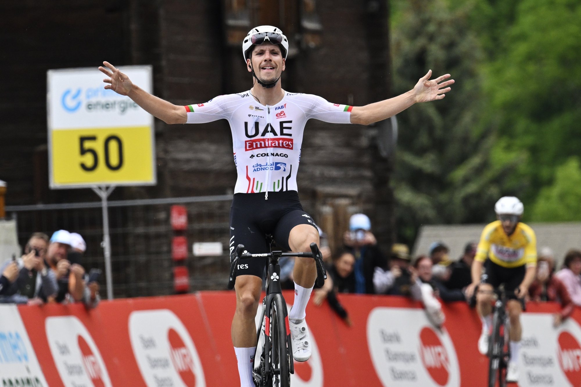 epa11409751 UAE Team Emirates rider Joao Almeida of Portugal celebrates winning the sixth stage of the Tour de Suisse, a 42.5km cycling race from Ulrichen to Blatten-Belalp, Switzerland, 14 June 2024.  EPA/GIAN EHRENZELLER