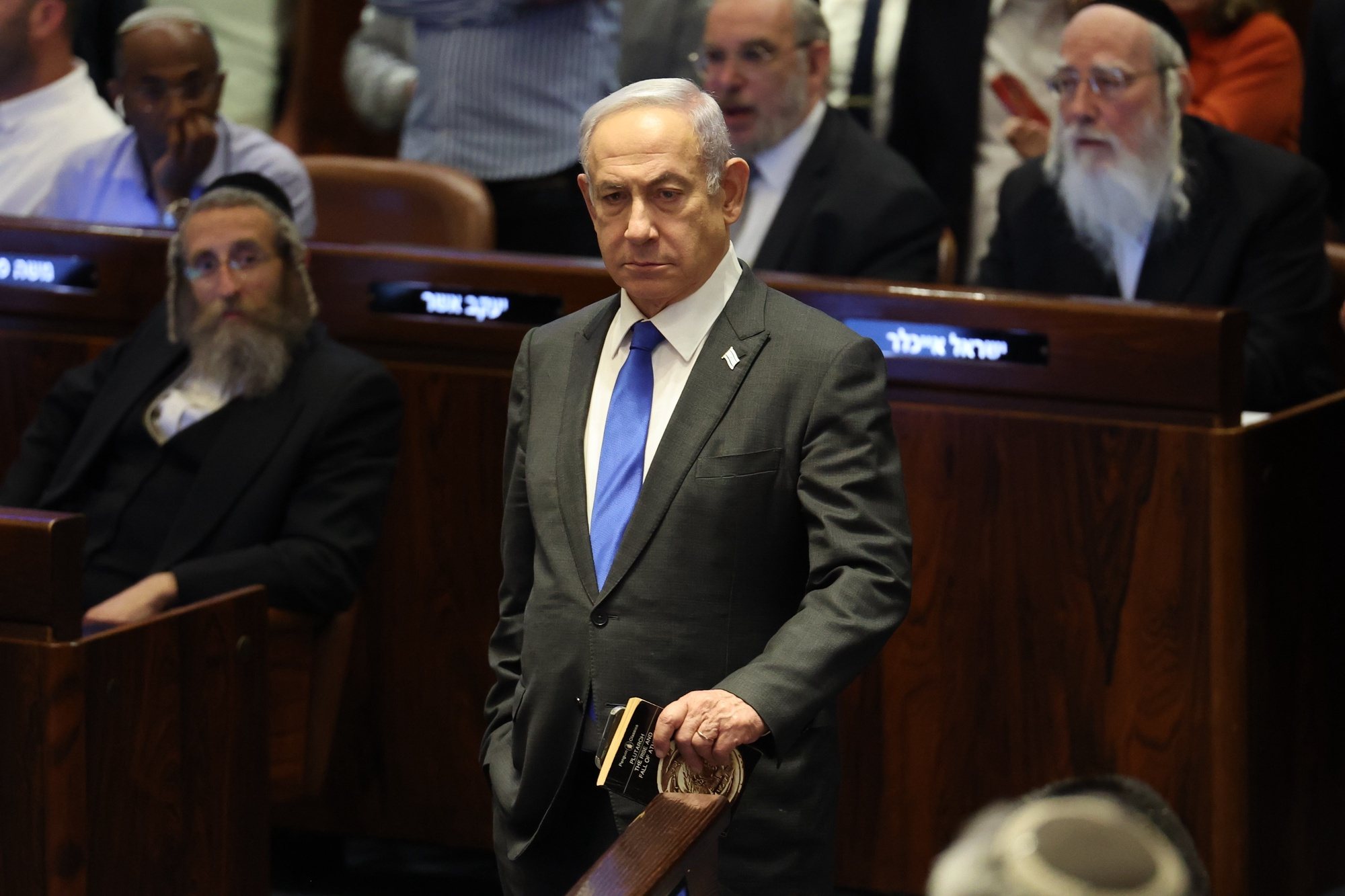 epaselect epa11403053 Israeli Prime Minister Benjamin Netanyahu (C) attends the Knesset plenum vote on the ultra-Orthodox conscription to military service law, in the Knesset, Israeli parliament in Jerusalem, 10 June 2024. The Knesset vote on the controversial exemption for ultra-Orthodox Yeshiva students from military conscription. Israel’s Supreme Court heard on 02 June a response by the state over the ultra-Orthodox recruitment issue, after previously extending a deadline for the government to present a conscription plan for ultra-Orthodox Jews, who are traditionally exempt from military service.  EPA/ABIR SULTAN